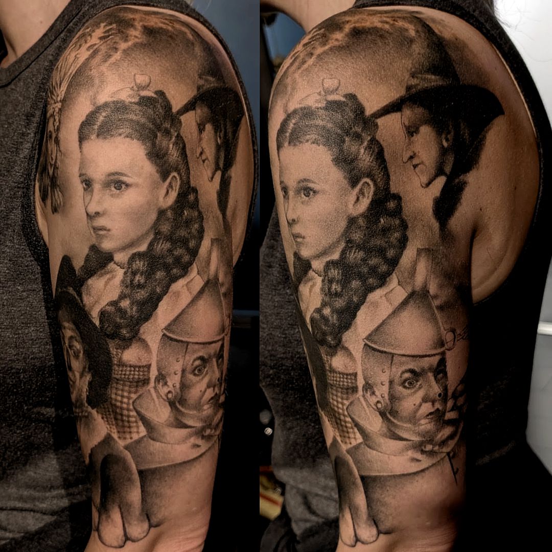 Wizard of oz characters realism tattoo on the upper arm by Dave Chercourt, Willoughby, Ohio