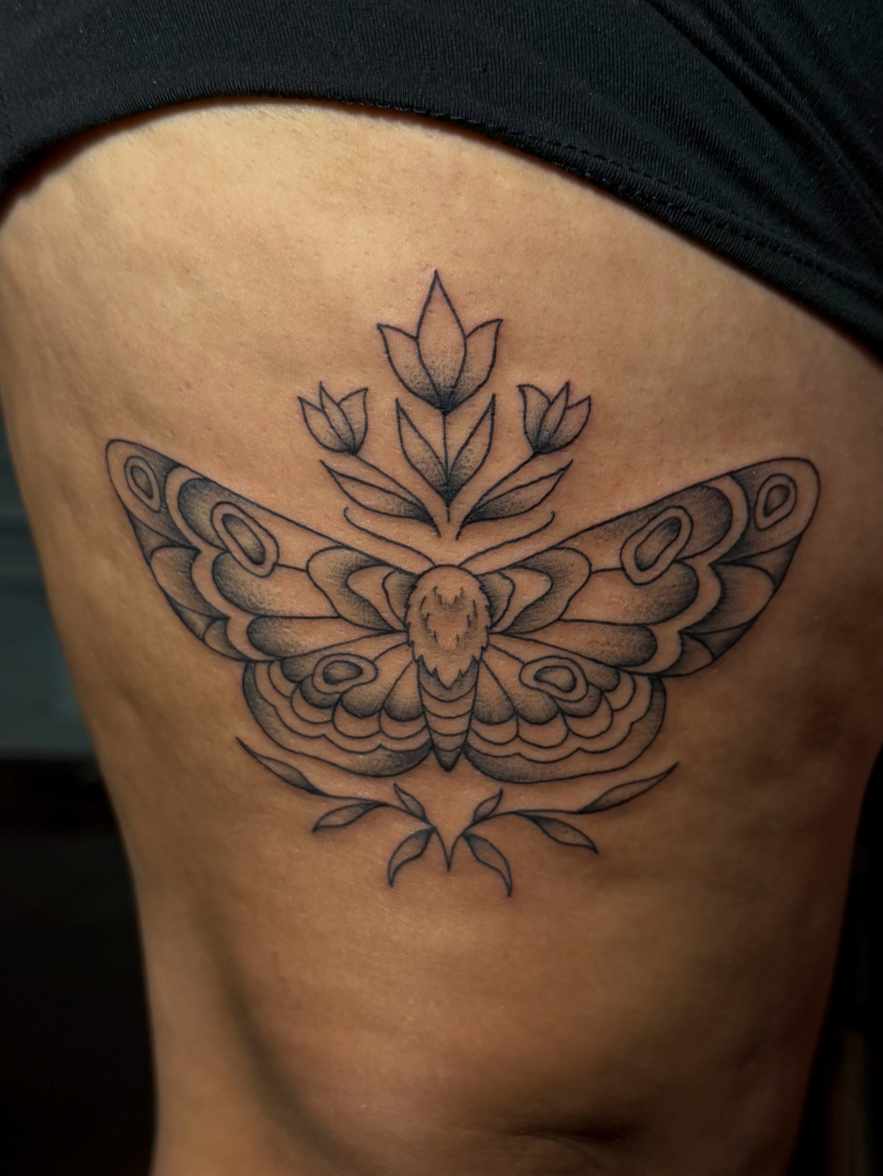 Butterfly black and grey tattoo on the thigh by Alaska ⚜️