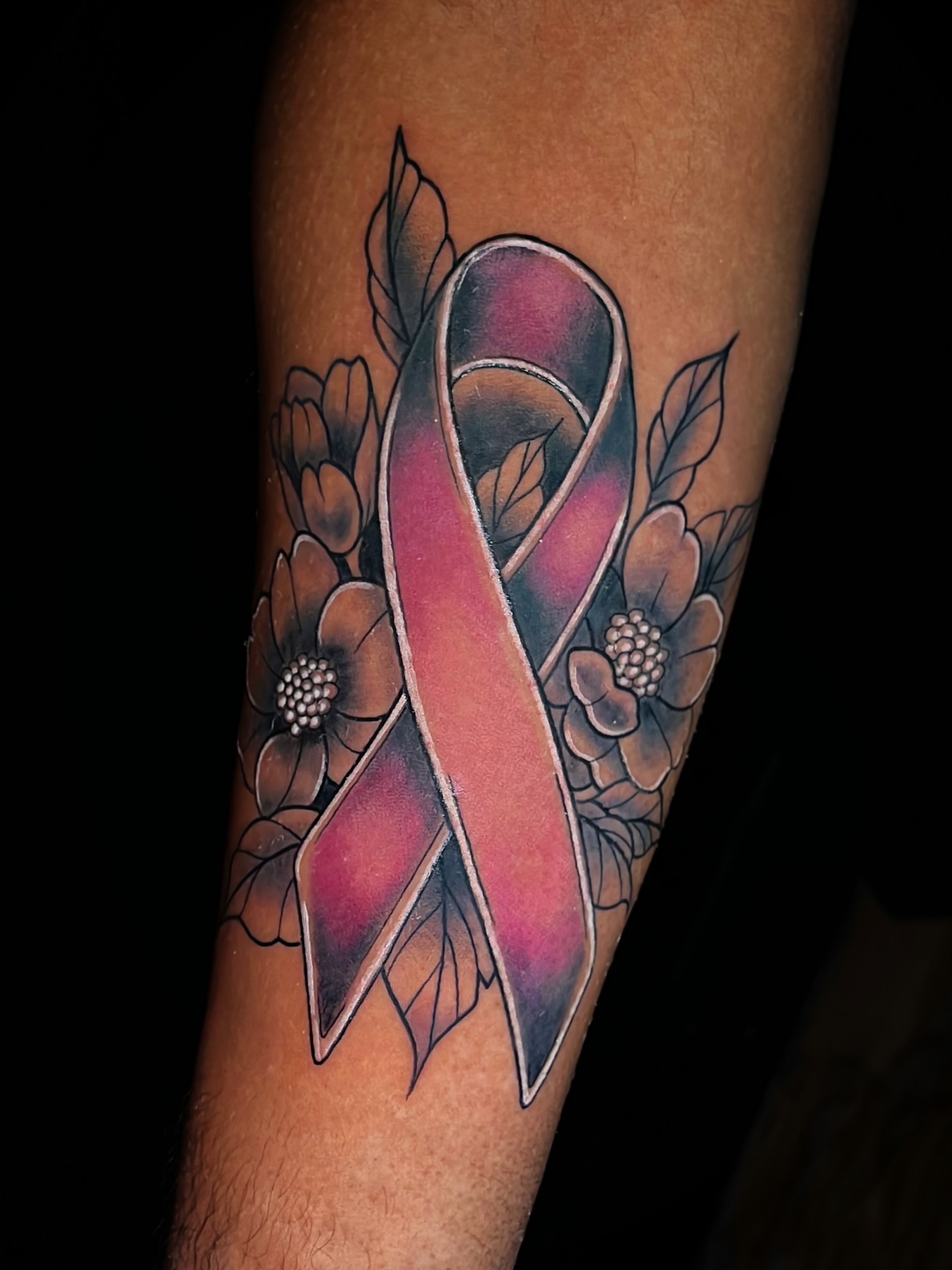 Breast cancer awareness ribbon realism tattoo on the forearm by Kyle Schneider