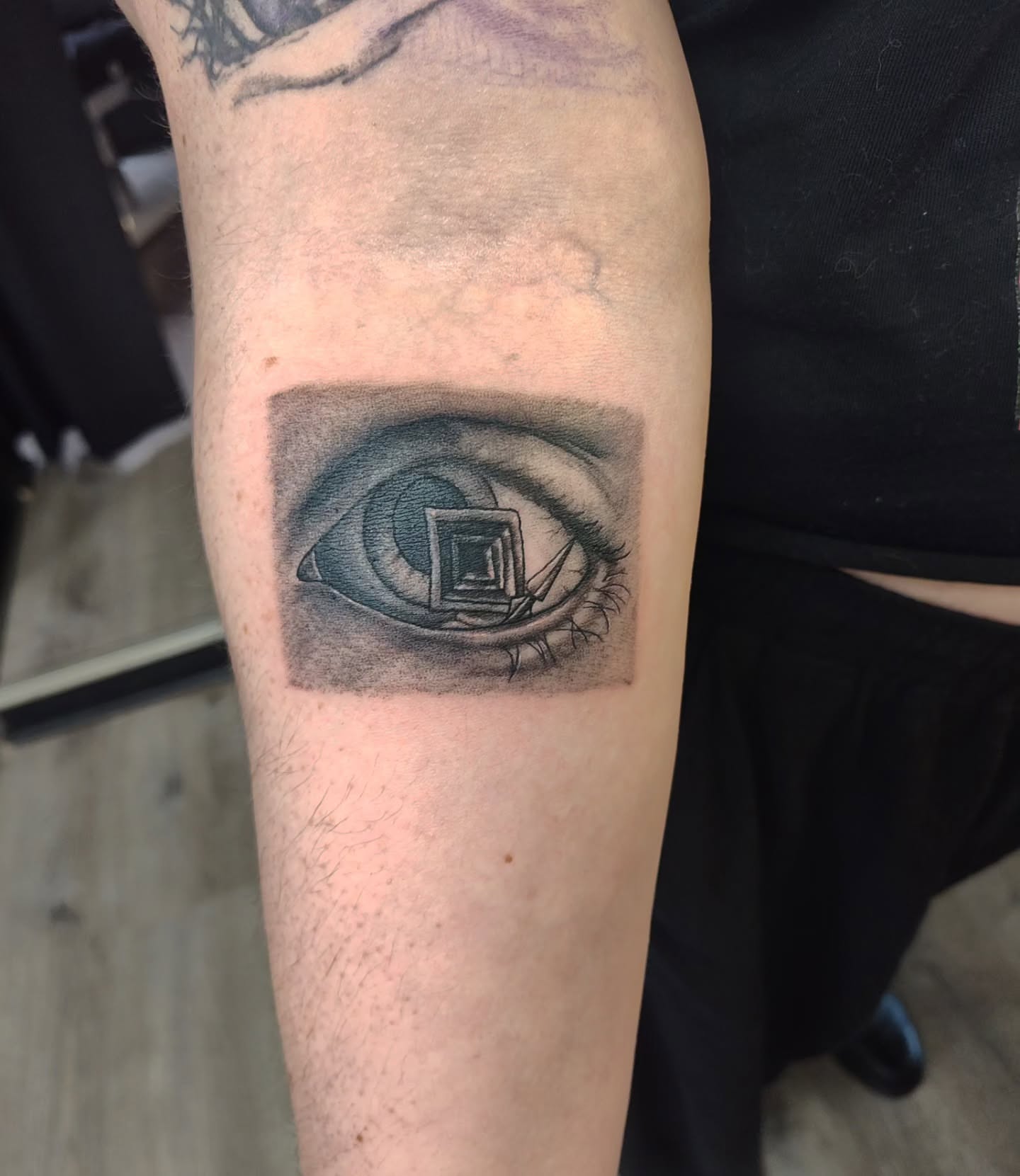 Eye realism tattoo on the forearm by Mercury