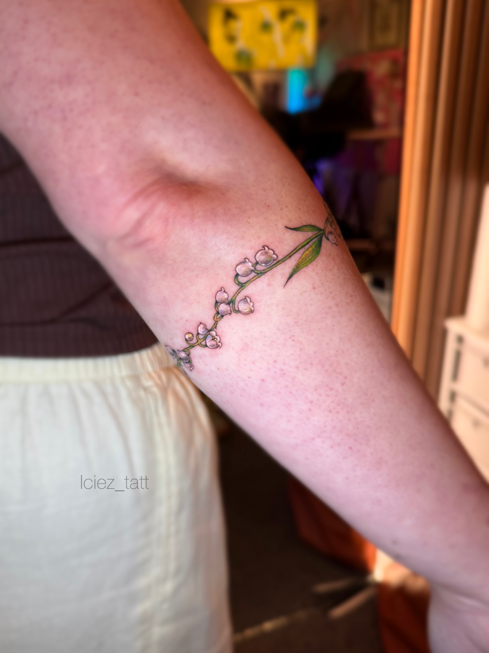Lily of the valley fine line tattoo on the forearm by Iciez