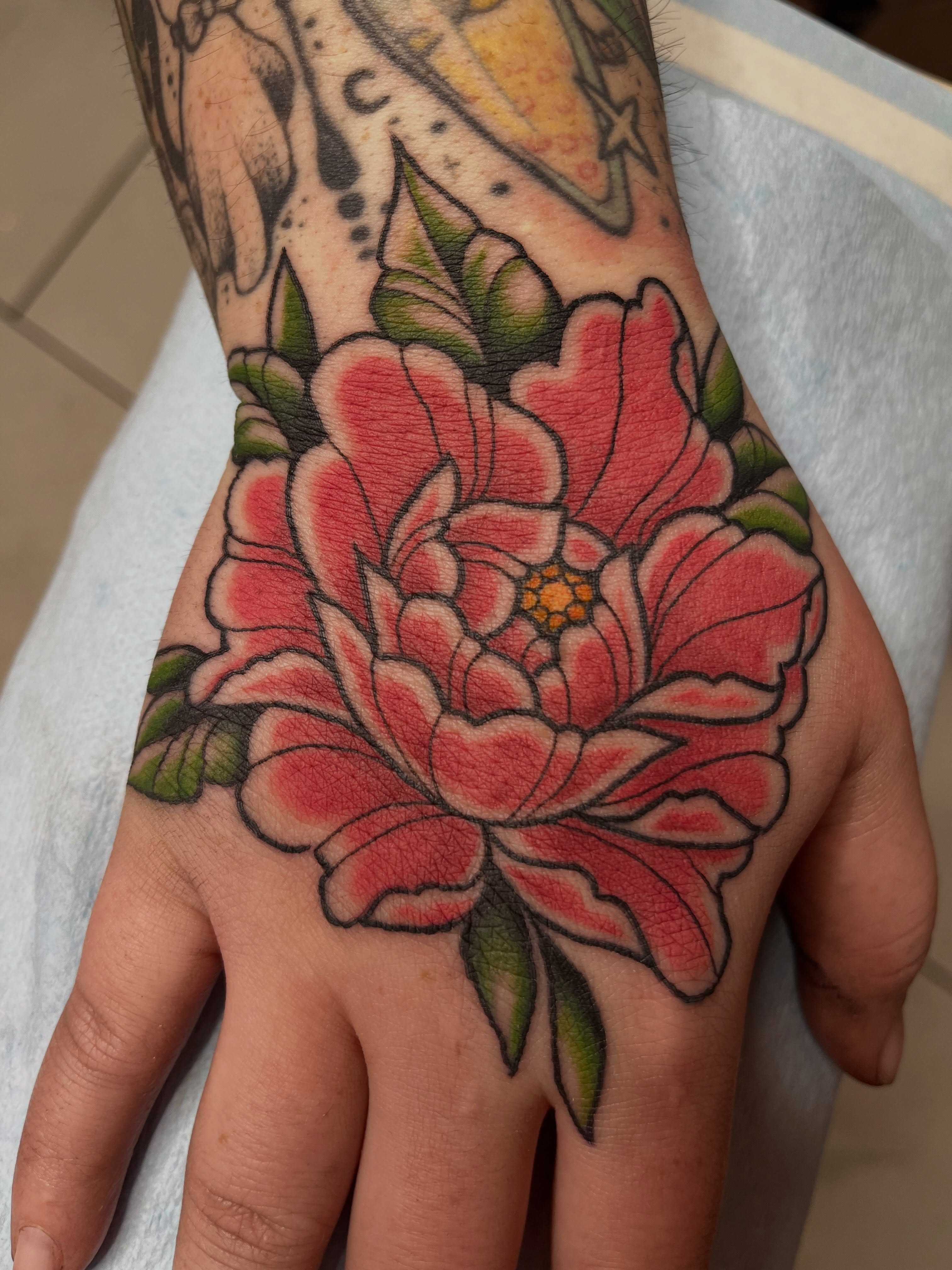 Peony flower American traditional tattoo on the hand by ✨ Chris ✨