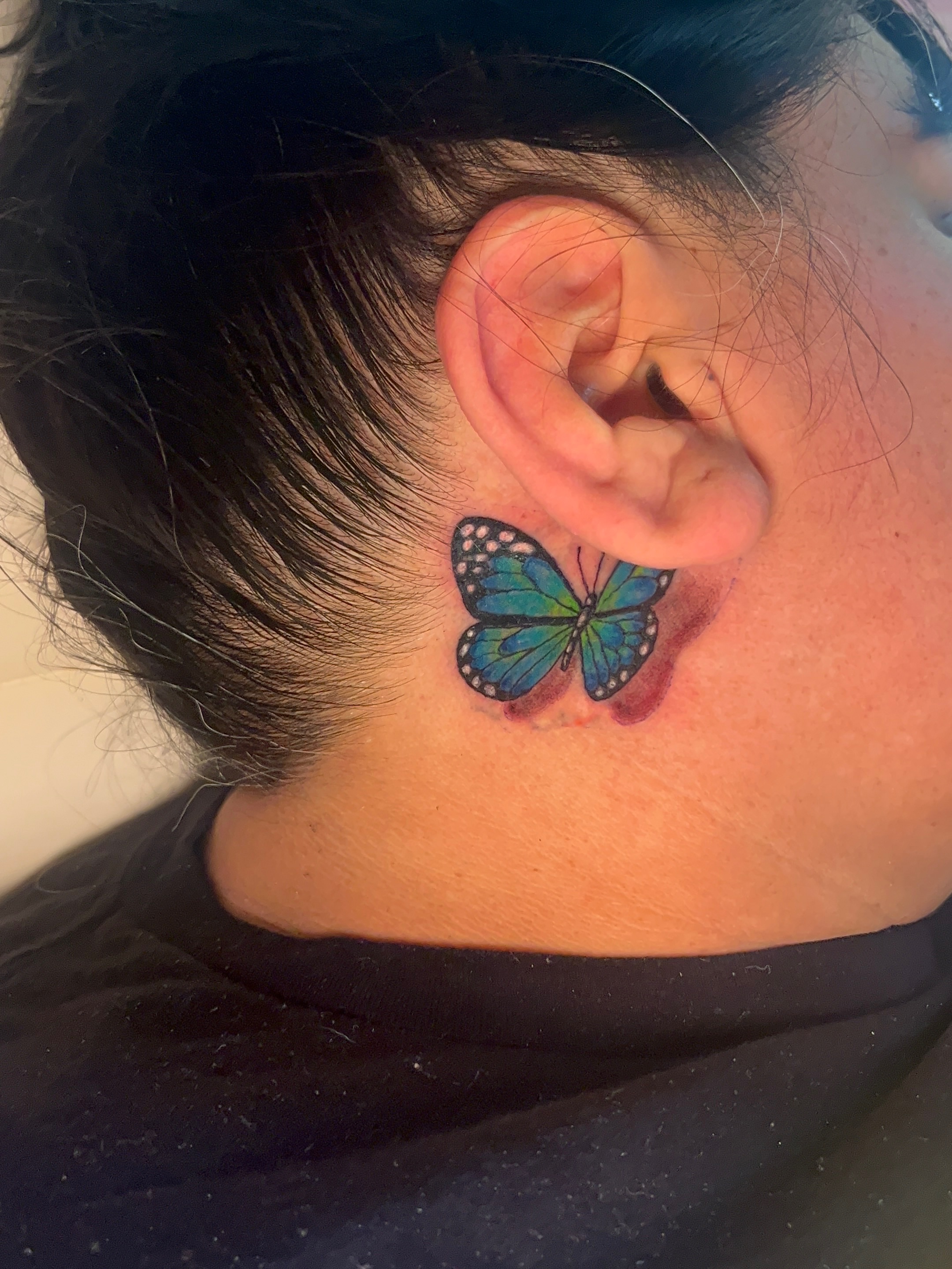 Butterfly realism tattoo on the neck by The inspo