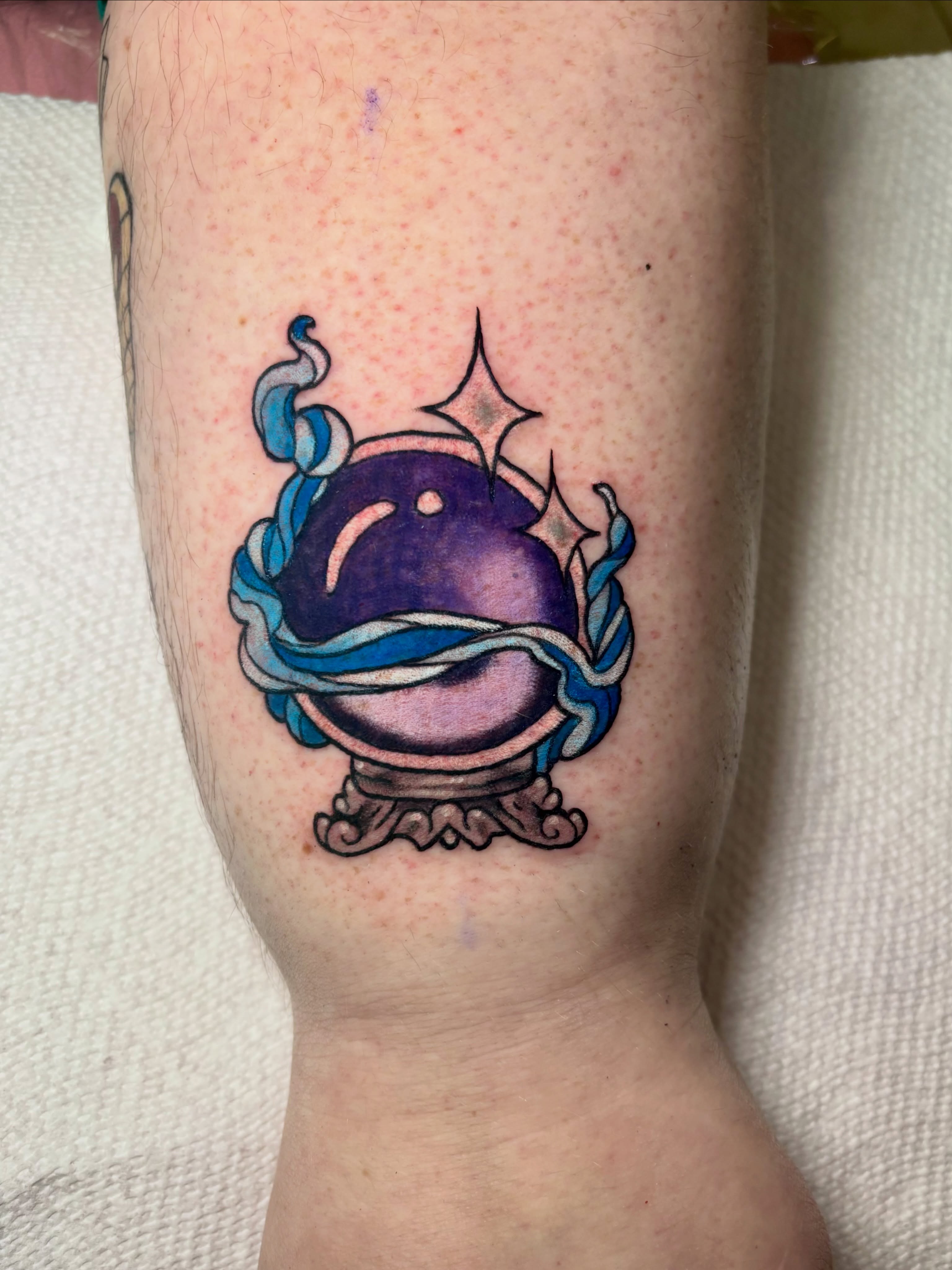 Crystal ball dotwork tattoo on the forearm by Bekah Smith
