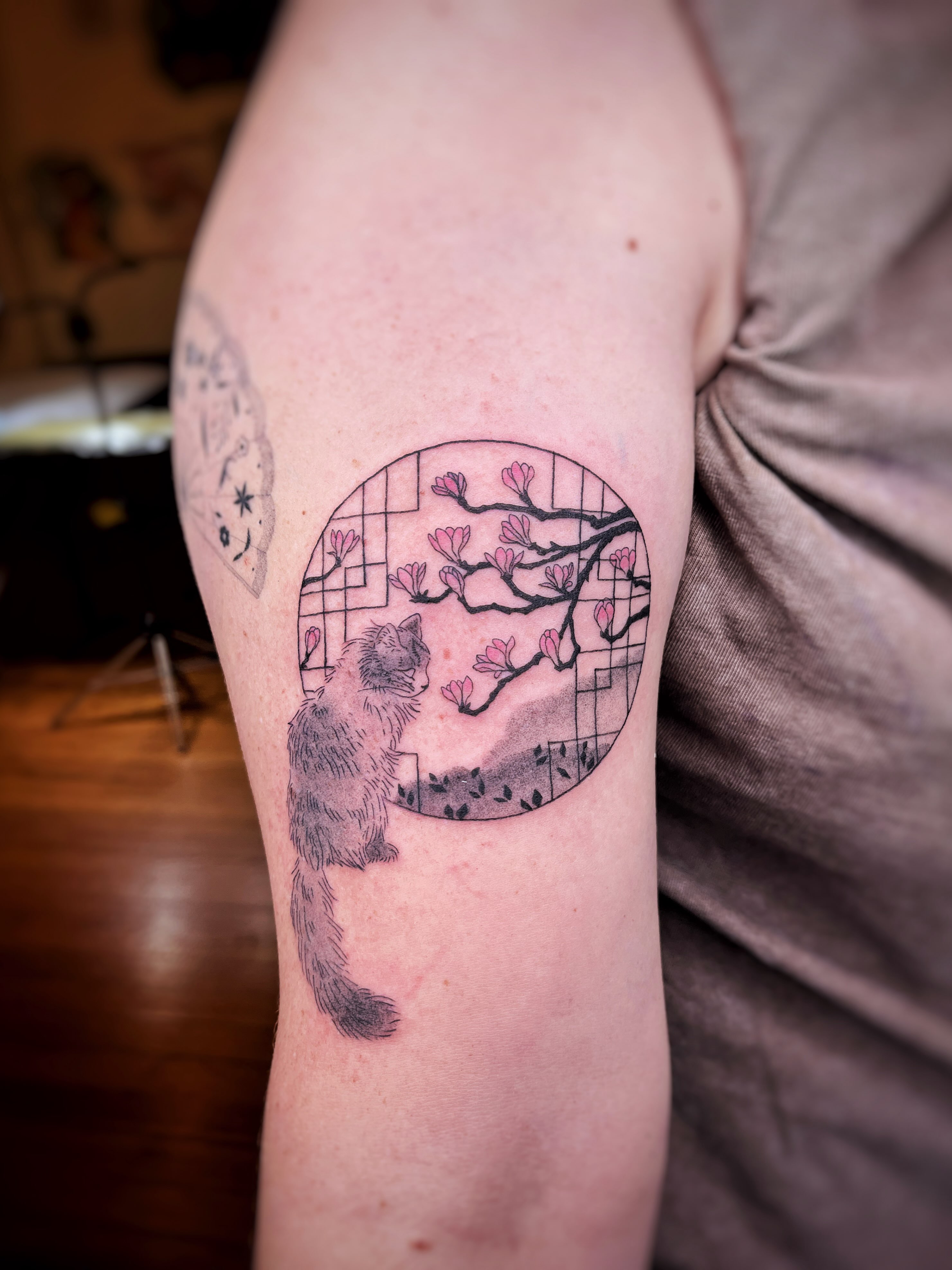 Cat and cherry blossoms japanese irezumi tattoo on the forearm by Risa Cincinnati Tattoo Artist