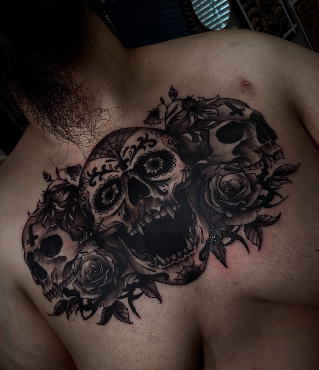 Skulls and roses realism tattoo on the chest by Nessa, Las Vegas, Nevada