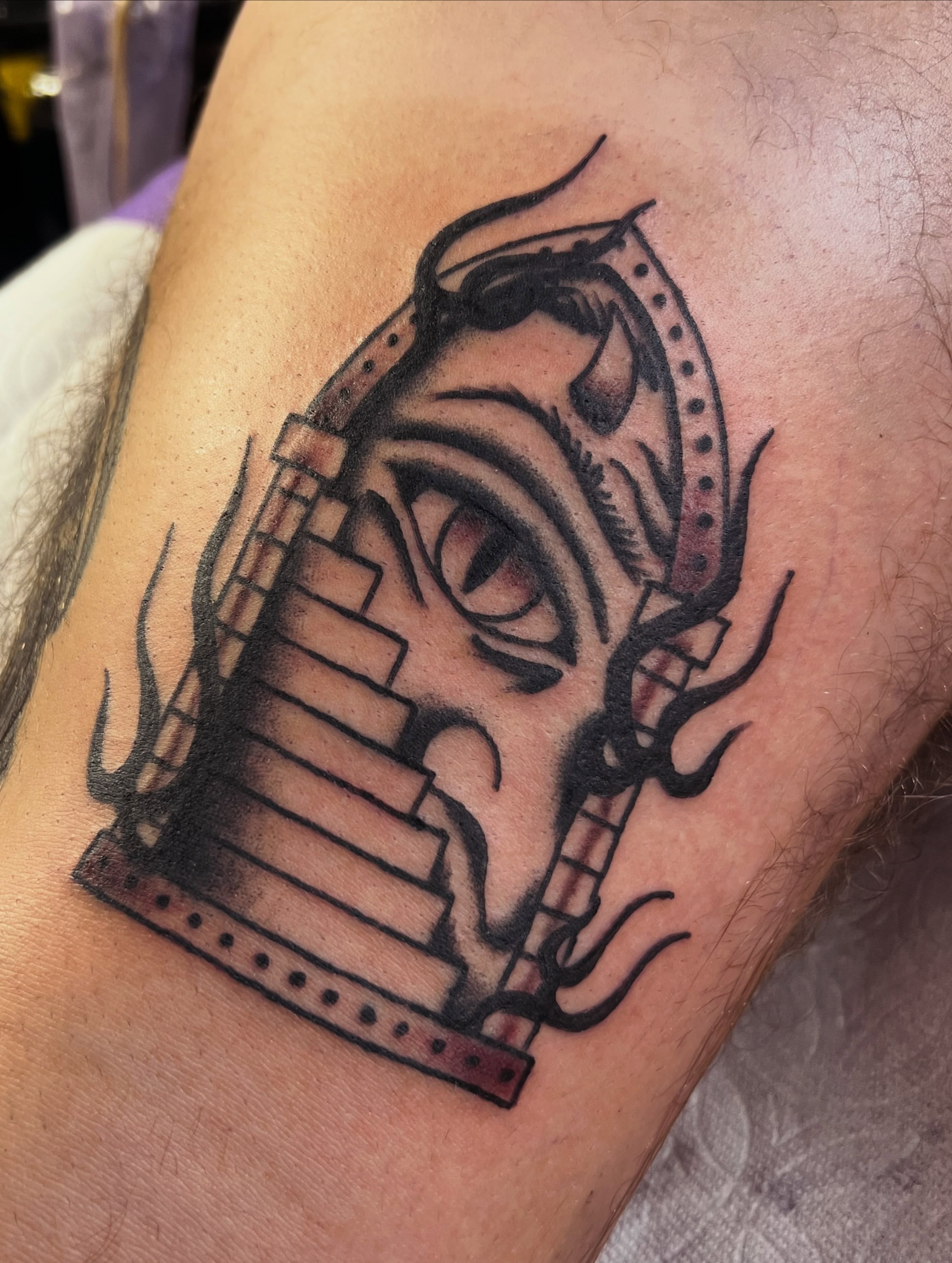 Filmstrip black and grey tattoo on the forearm by Samantha Citer