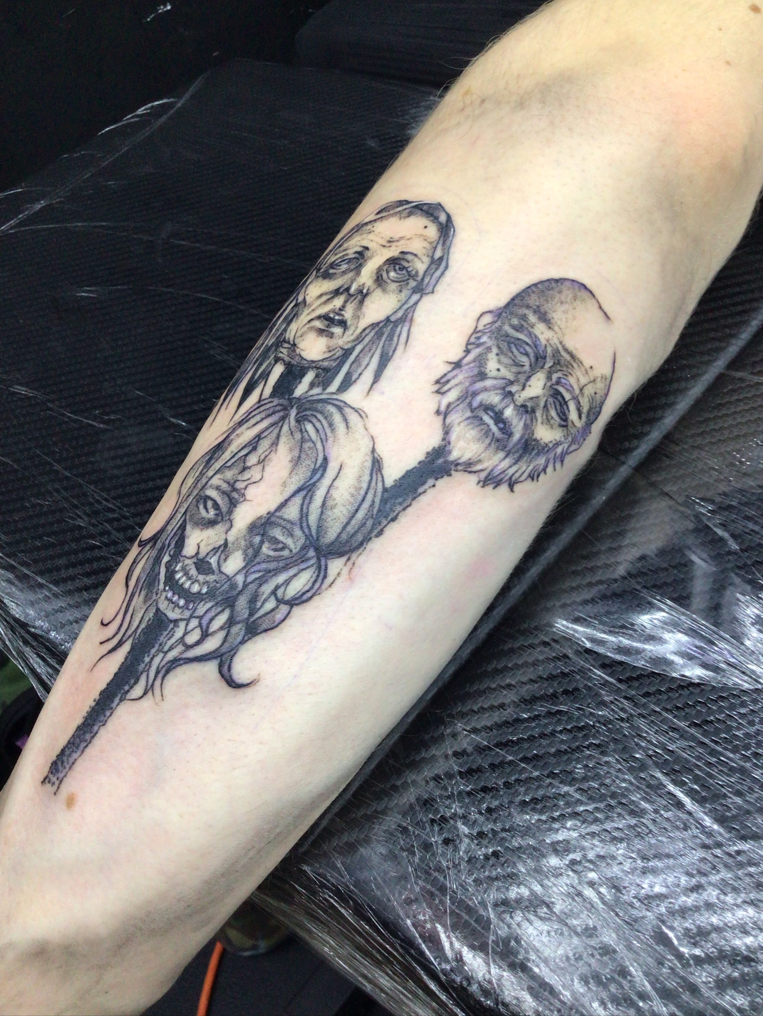 Three faces black and grey tattoo on the forearm by LolaCat🐉