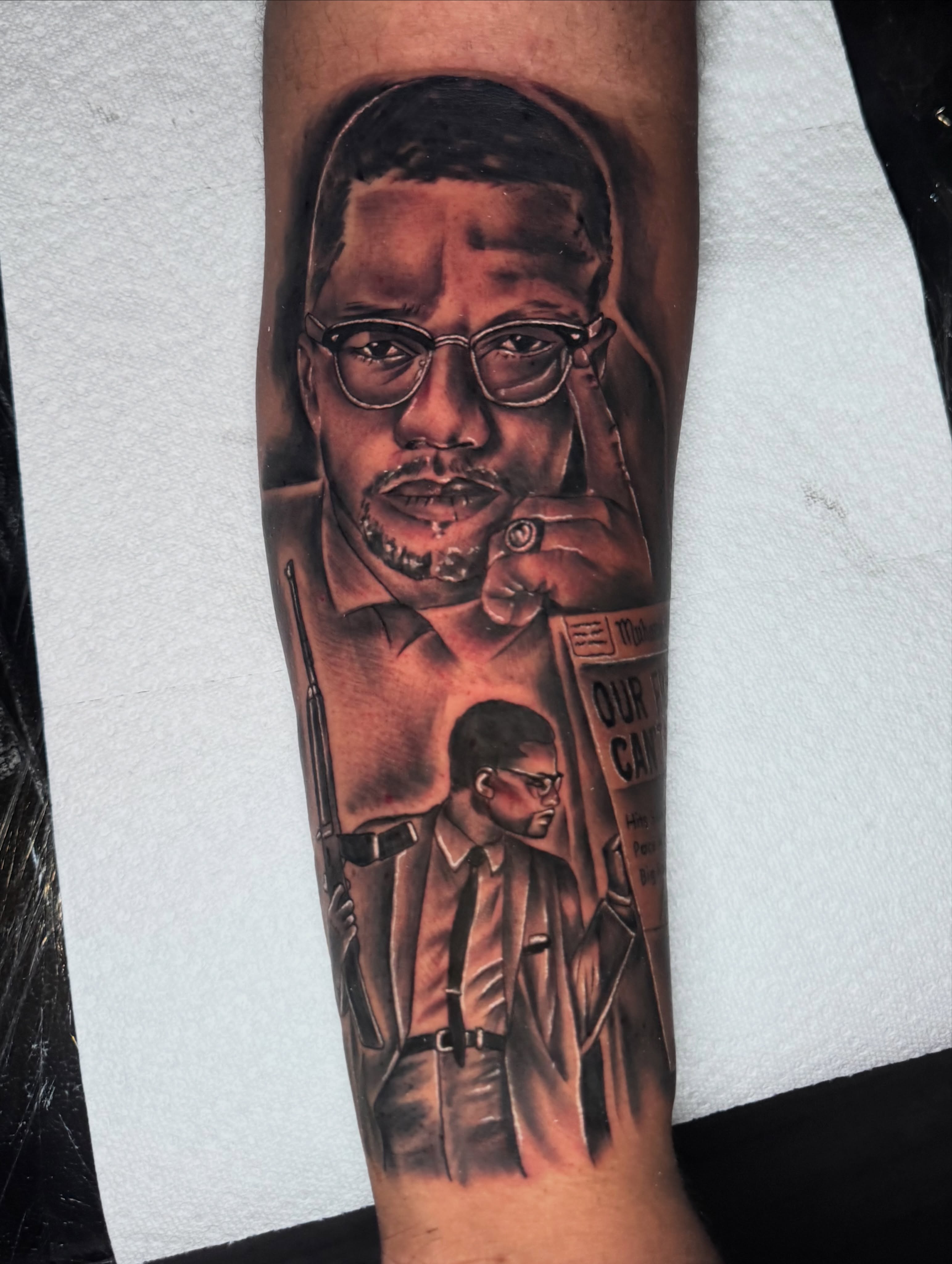 Malcolm X realism tattoo on the forearm by Zeus