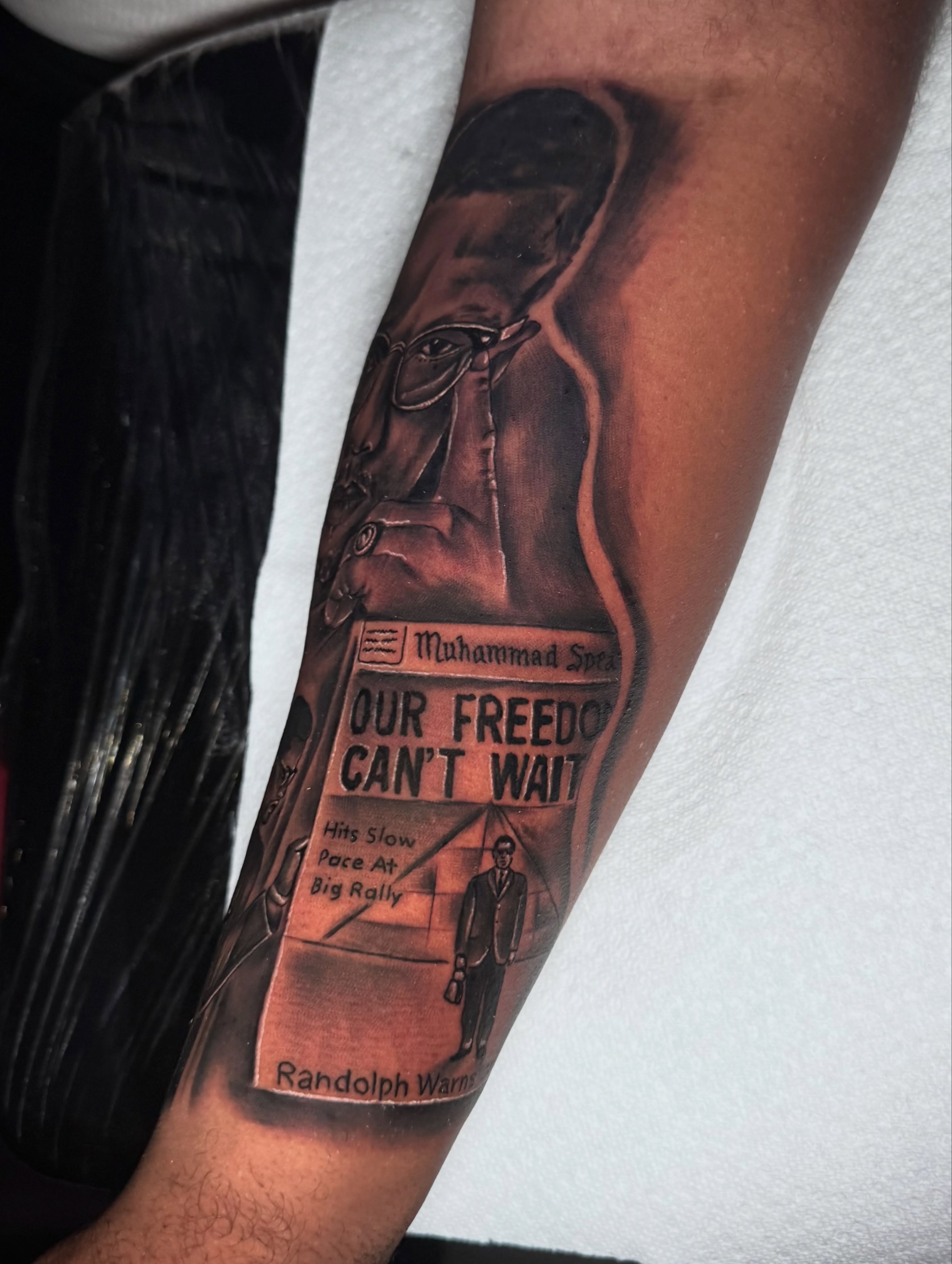 Muhammad spears newspaper headline realism tattoo on the forearm by Zeus