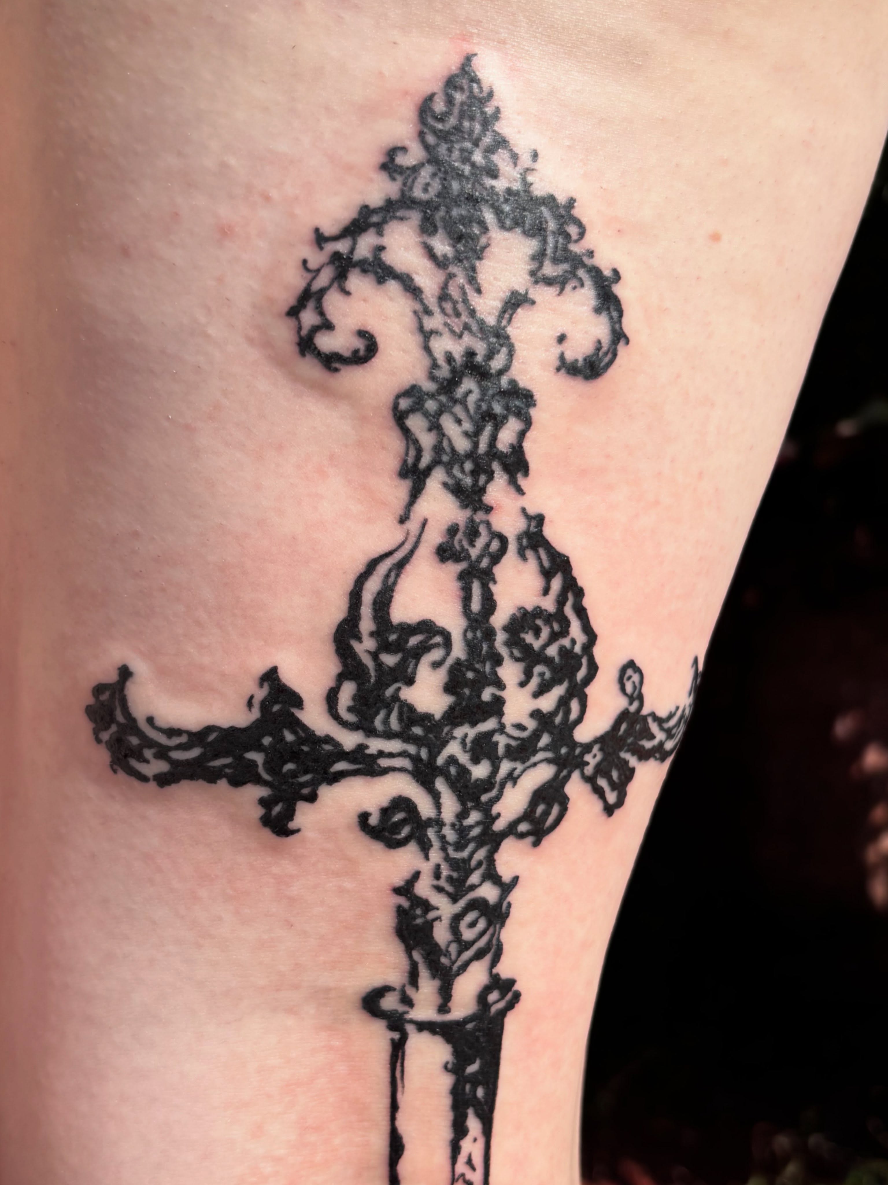 Cross black and grey tattoo on the thigh by Anna Kathleen, Des Moines, Iowa