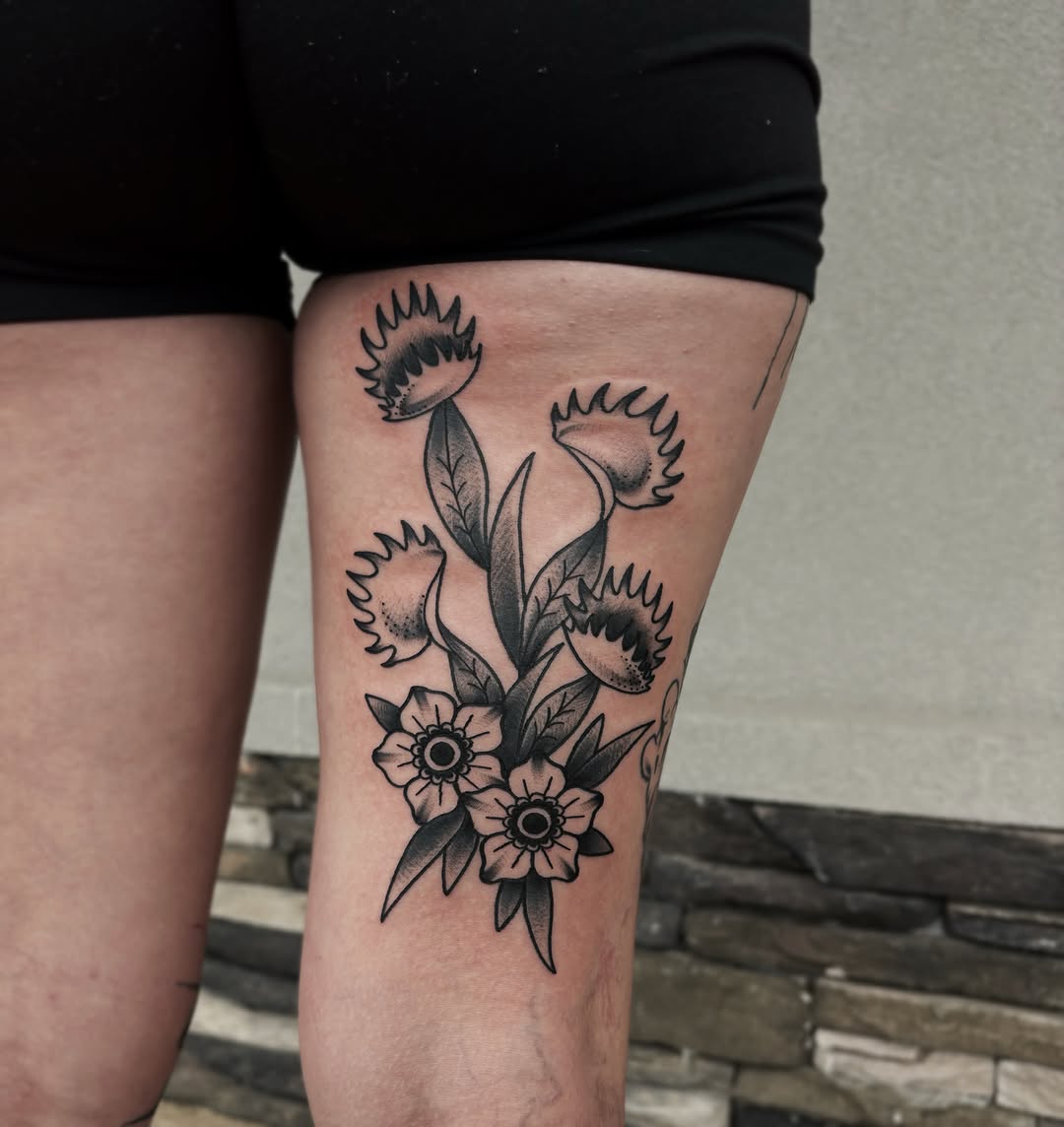 Floral bouquet black and grey tattoo on the thigh by Bunny Noel