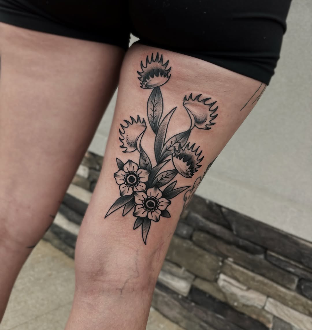 Floral bouquet black and grey tattoo on the thigh by Bunny Noel