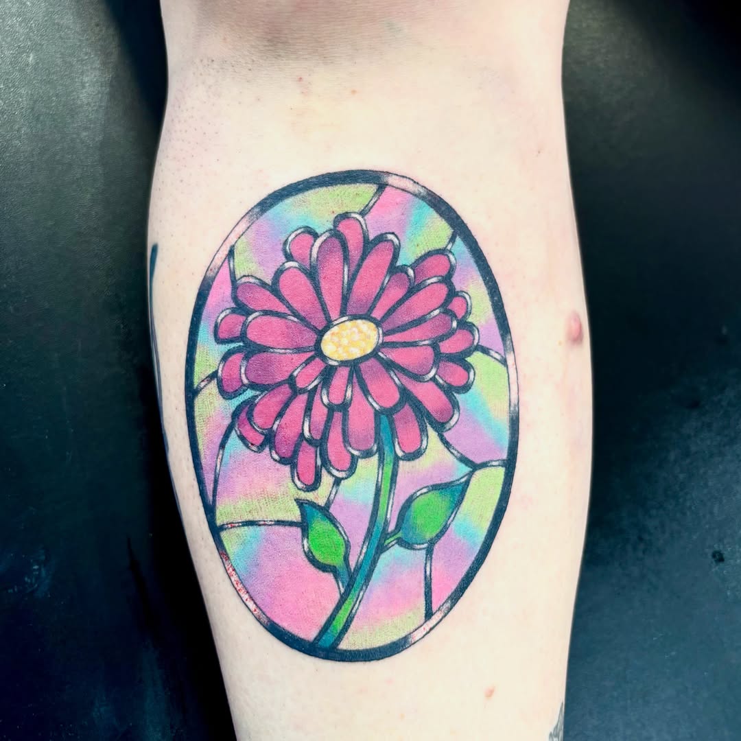 Stained glass flower tattoo on the forearm by Taylor  Thompson