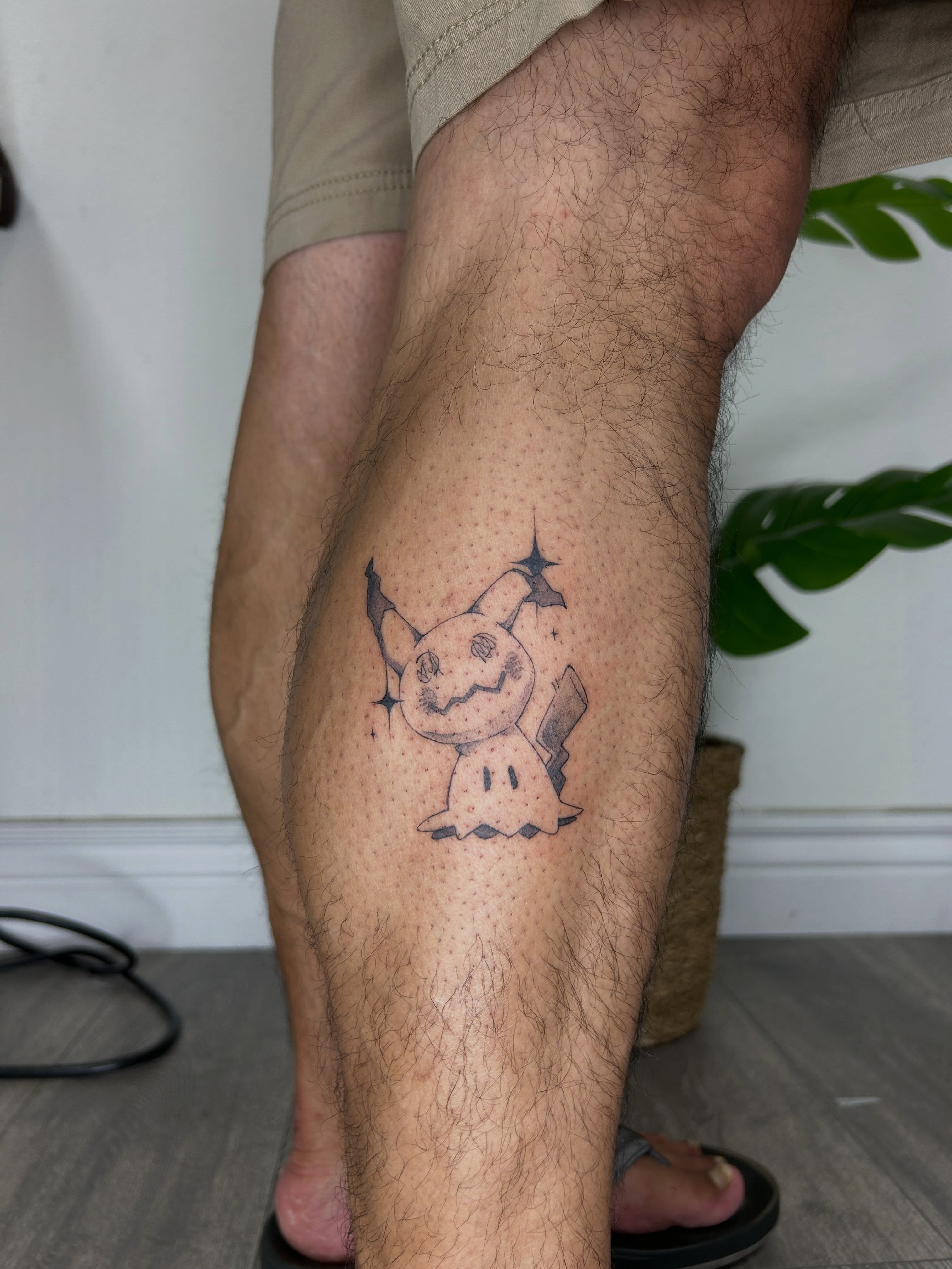 Mimikyu dotwork tattoo on the calf by Miri