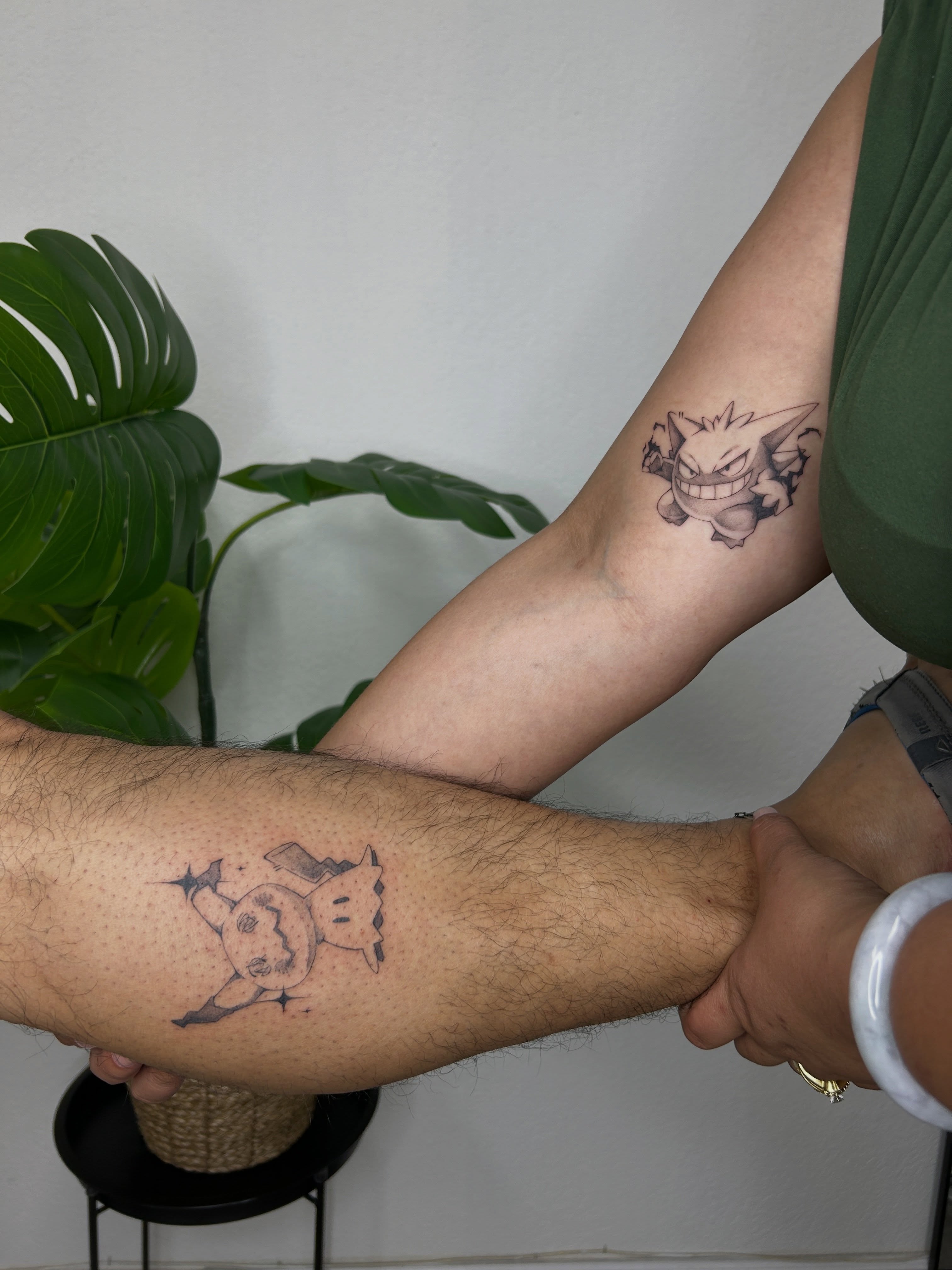 Gengar and Mimikyu dotwork tattoo on the forearm by Miri