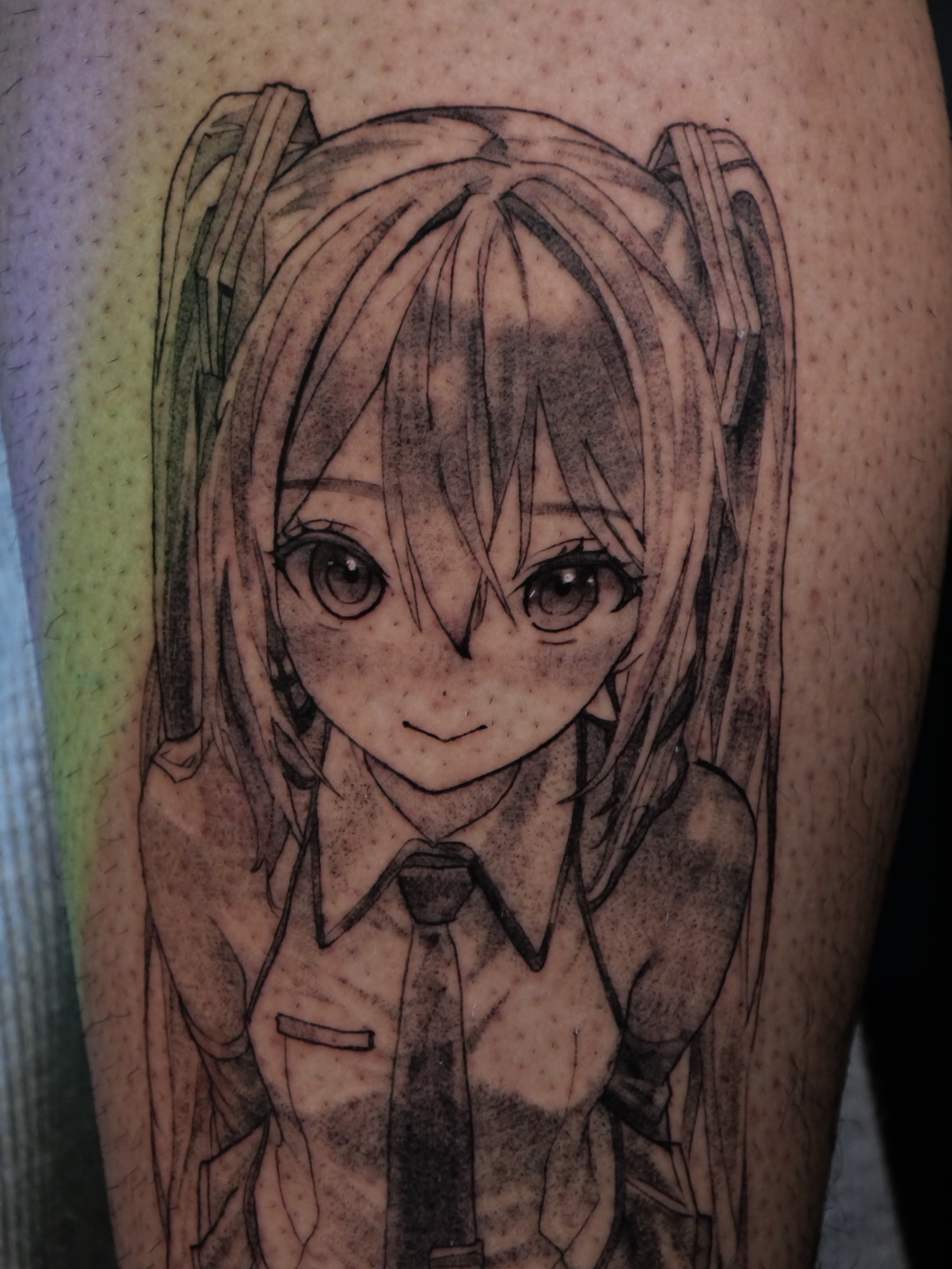 Anime character anime tattoo on the forearm by Sloppy