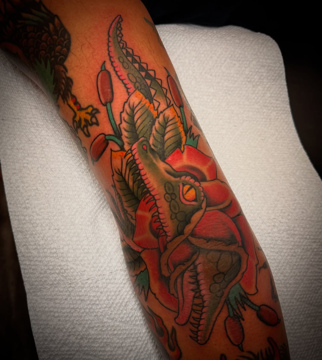 Dragon American traditional tattoo on the forearm by Dave Osrowitz