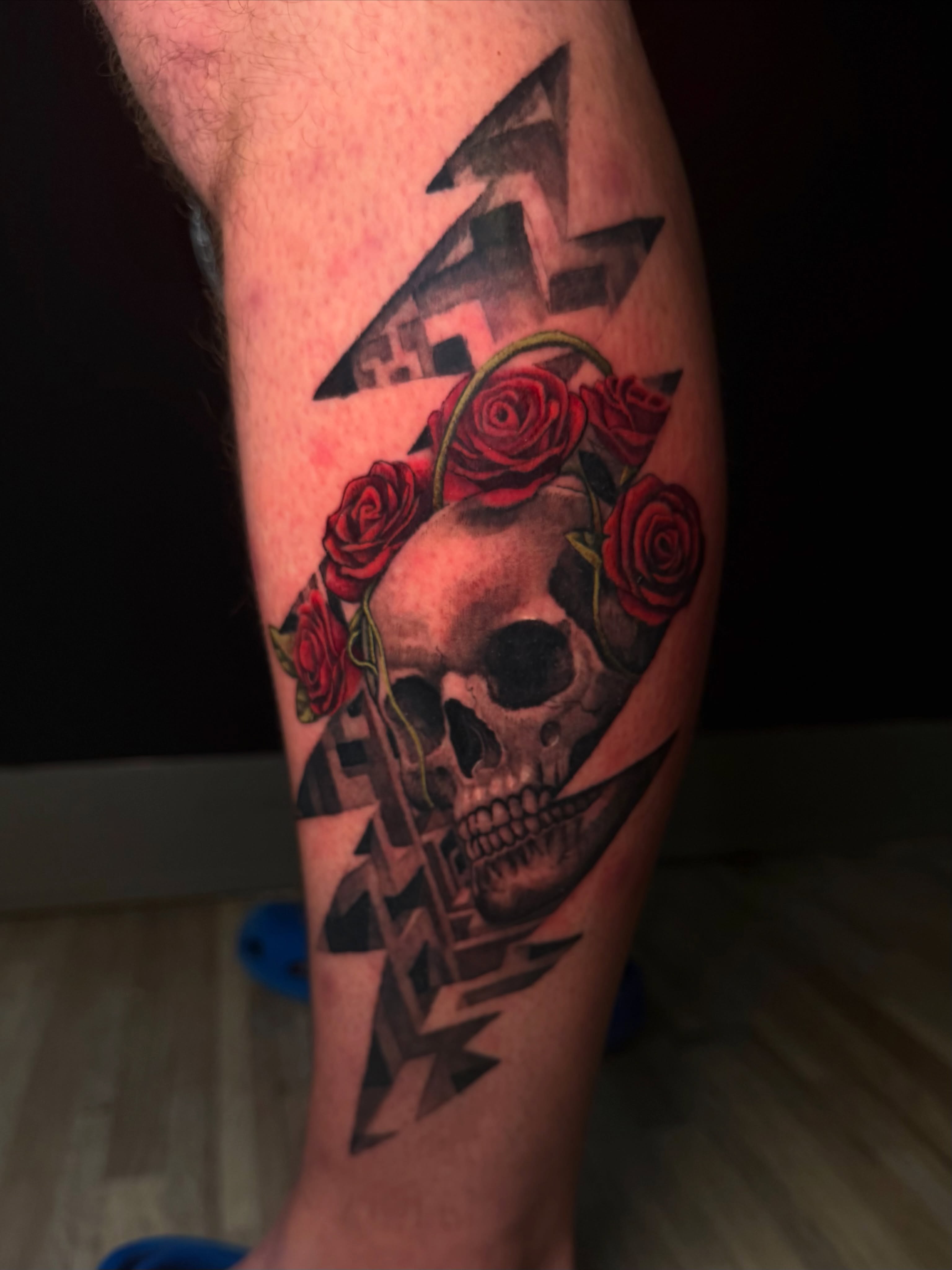 Skull with roses geometric tattoo on the forearm by Zachary Hayden