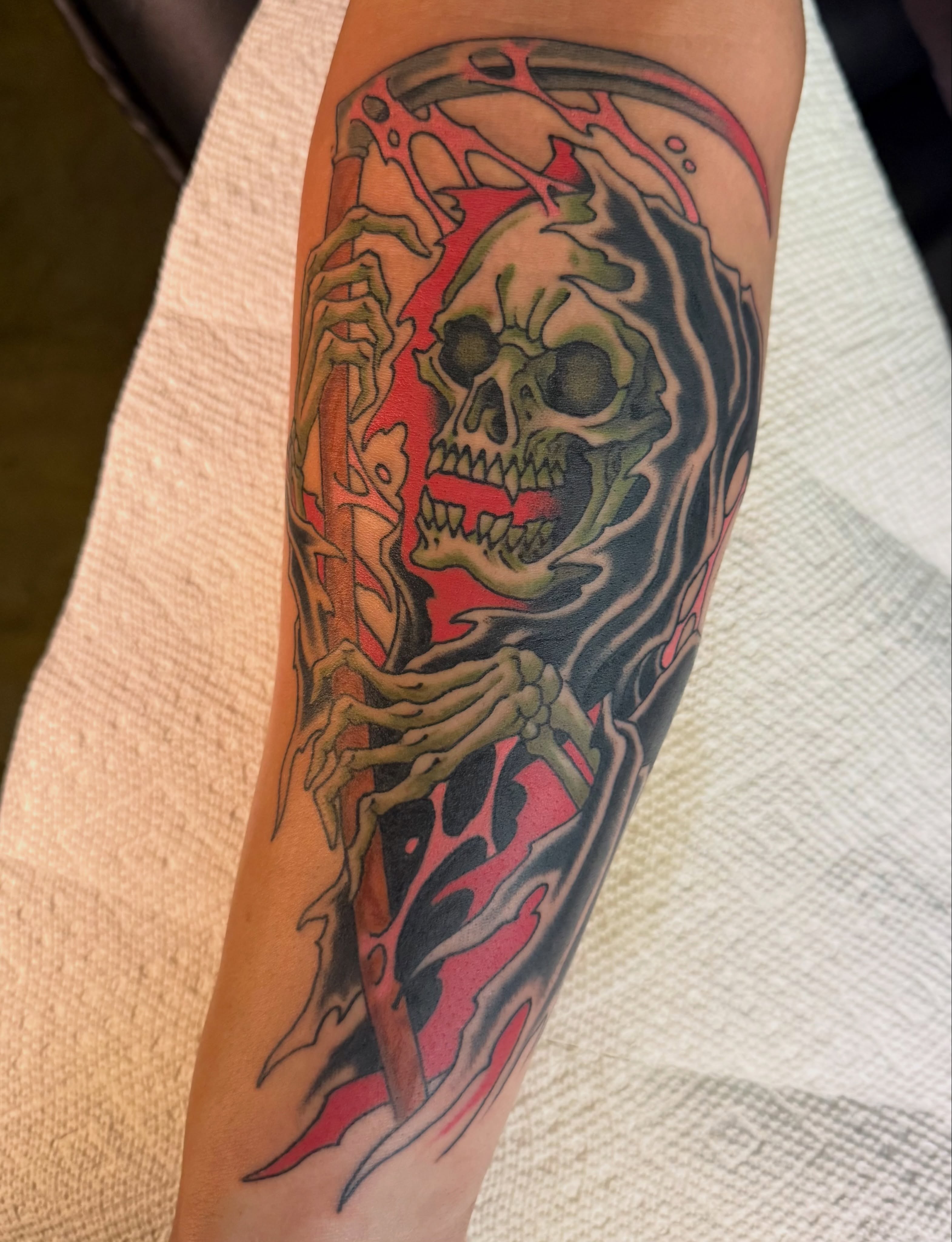Grim reaper American traditional tattoo on the forearm by Scott Kulikowski