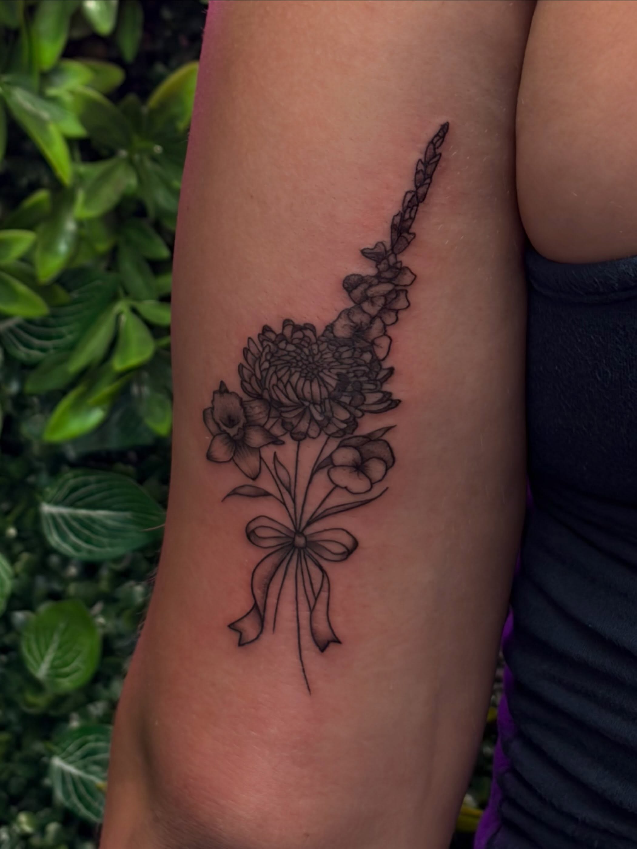 Flower bouquet black and grey tattoo on the forearm by Melissa