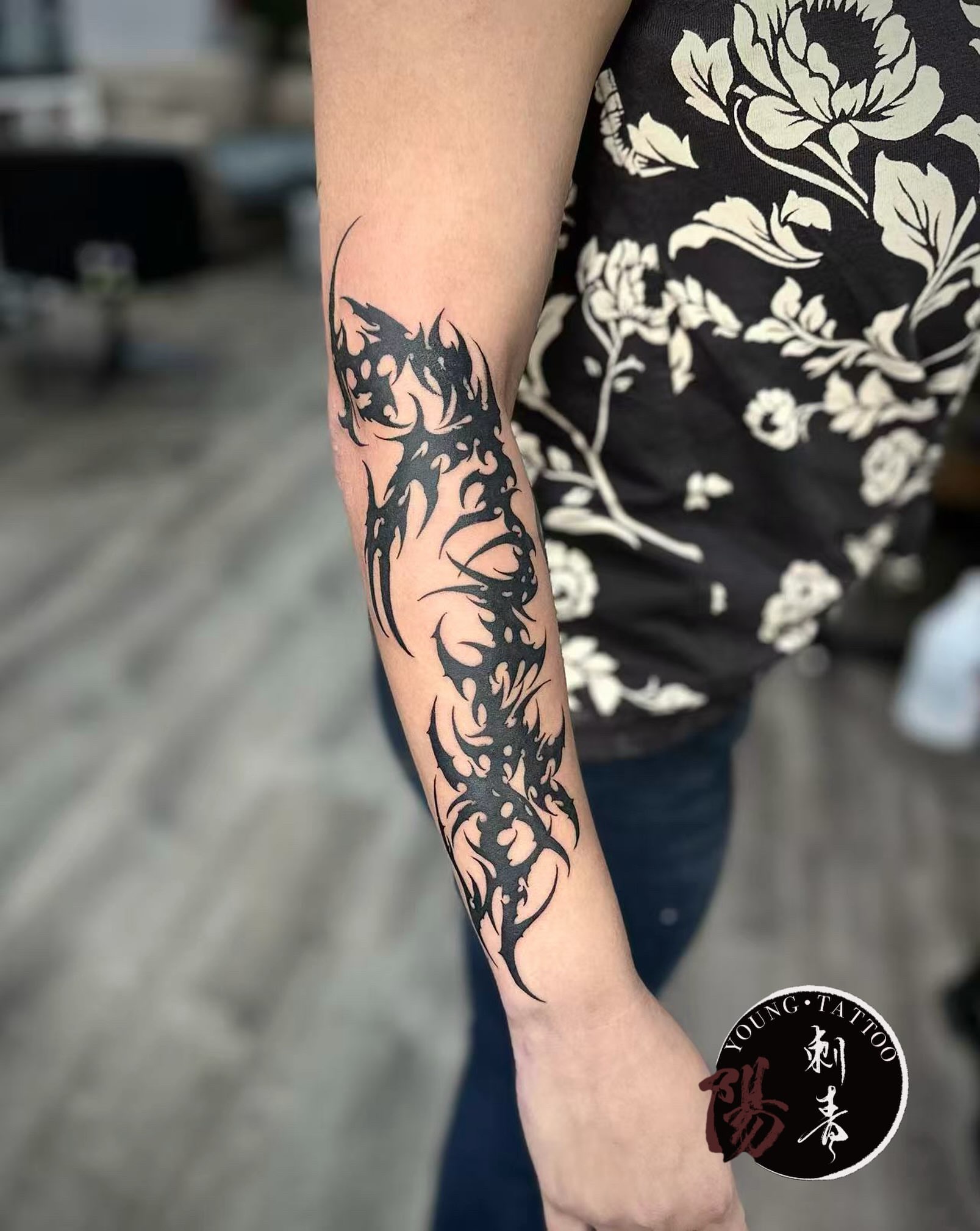 Tribal dragon tribal tattoo on the forearm by Ying
