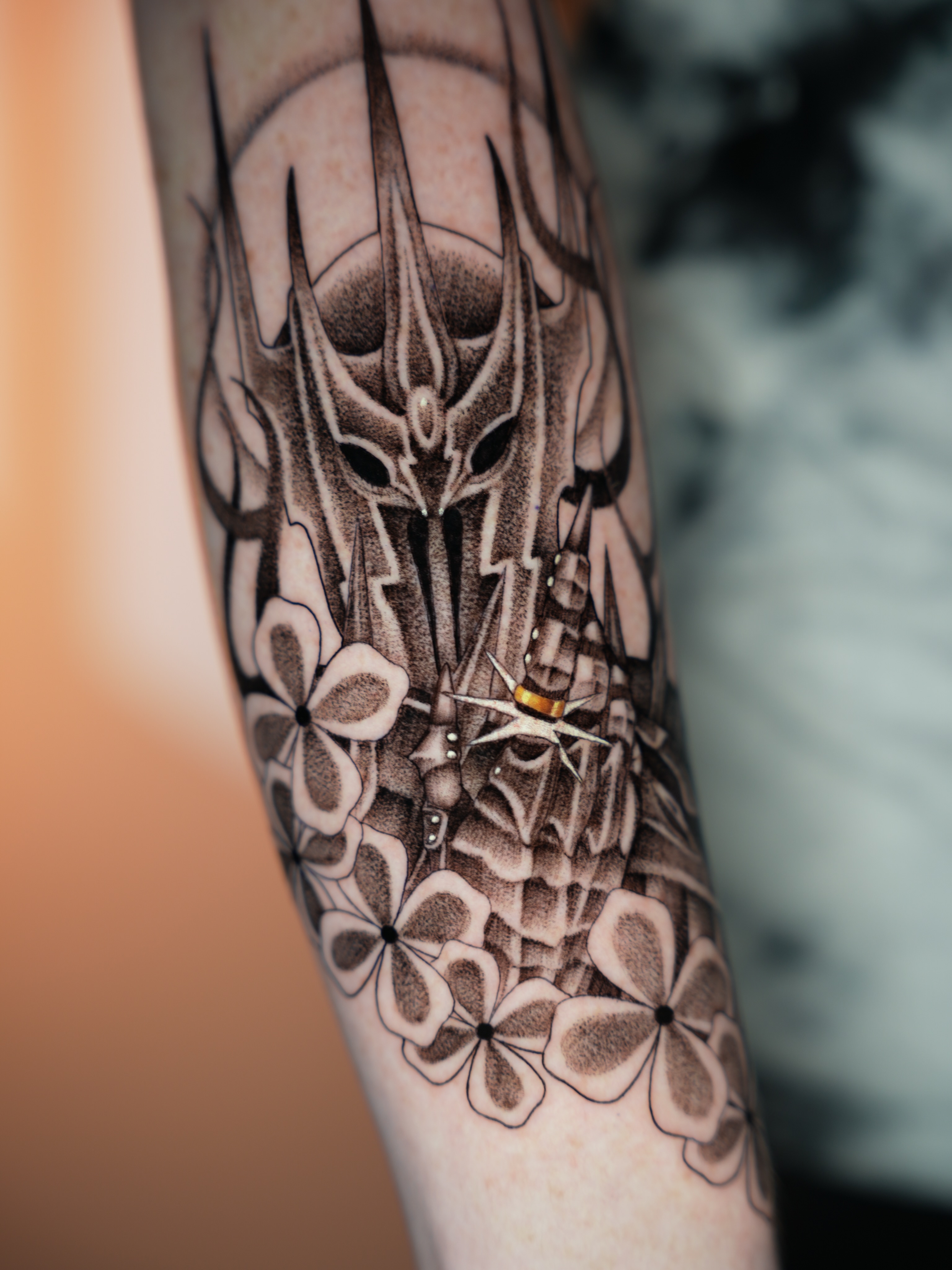 Dragon and flowers geometric tattoo on the forearm by Hannah Burnside, Charlotte, North Carolina