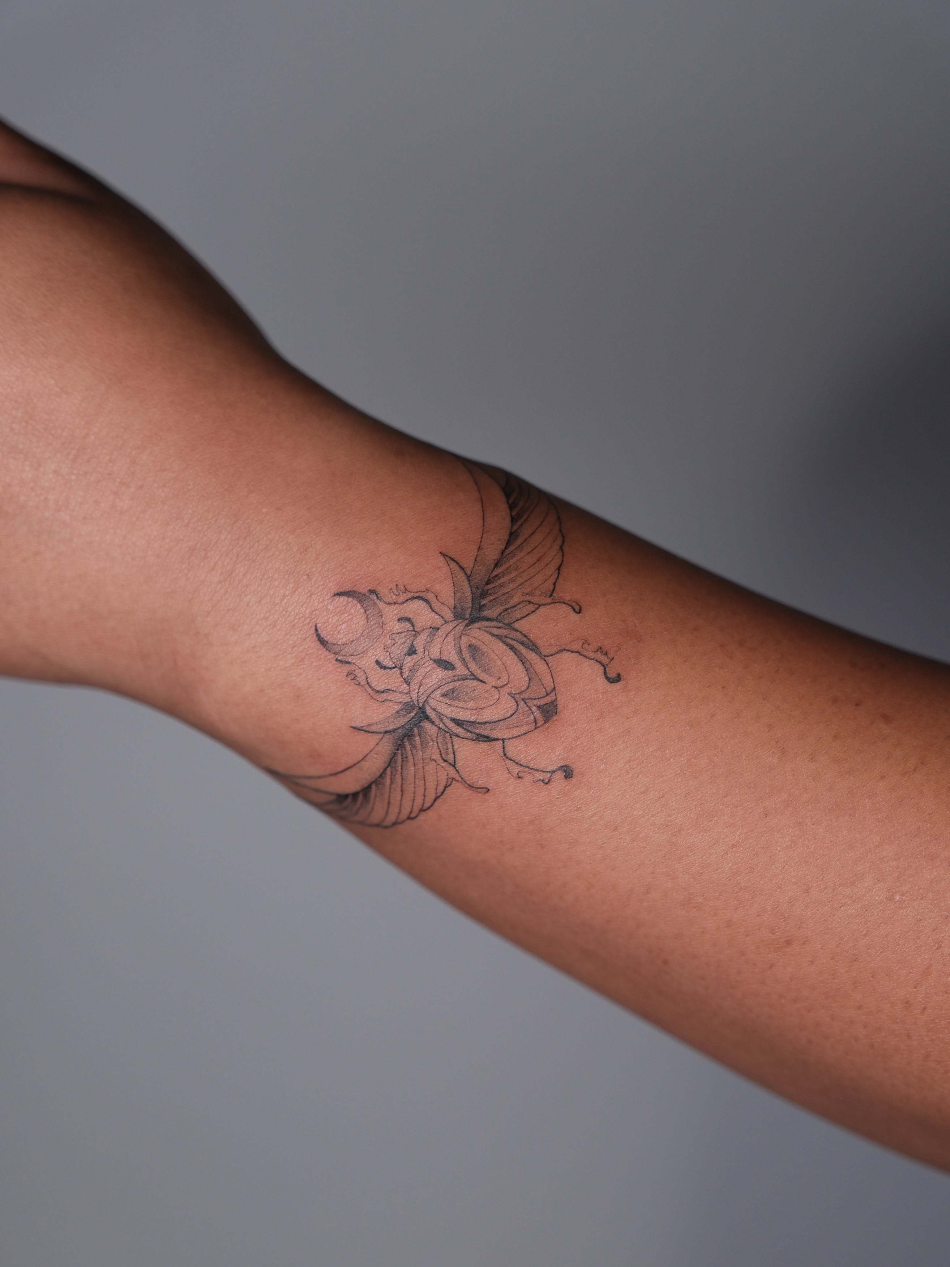 Rose and butterfly black and grey tattoo on the forearm by Vu Nguyen