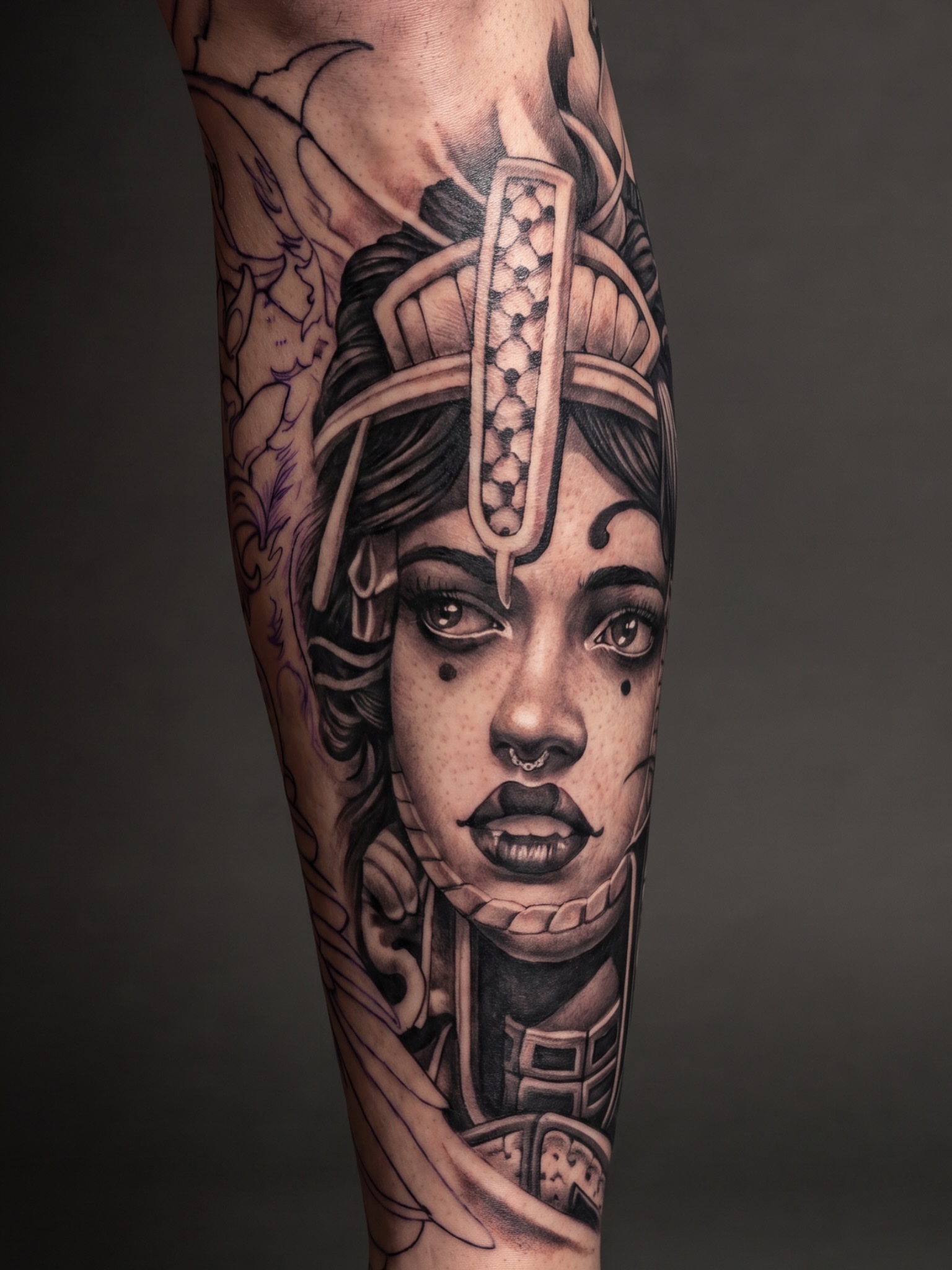 Woman with headdress realism tattoo on the forearm by Mike Nance