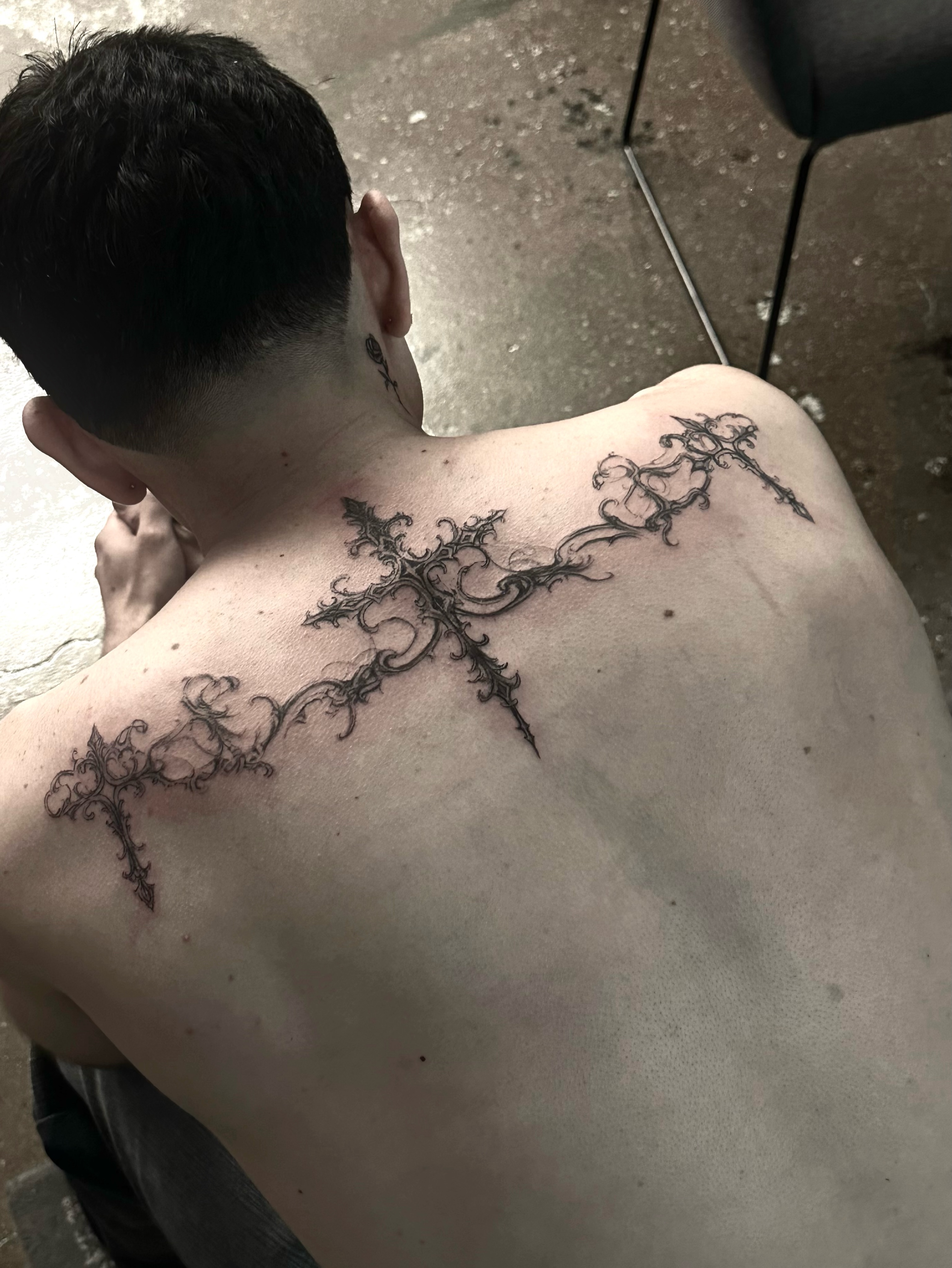 Crosses ornamental tattoo on the back by @ashencoil