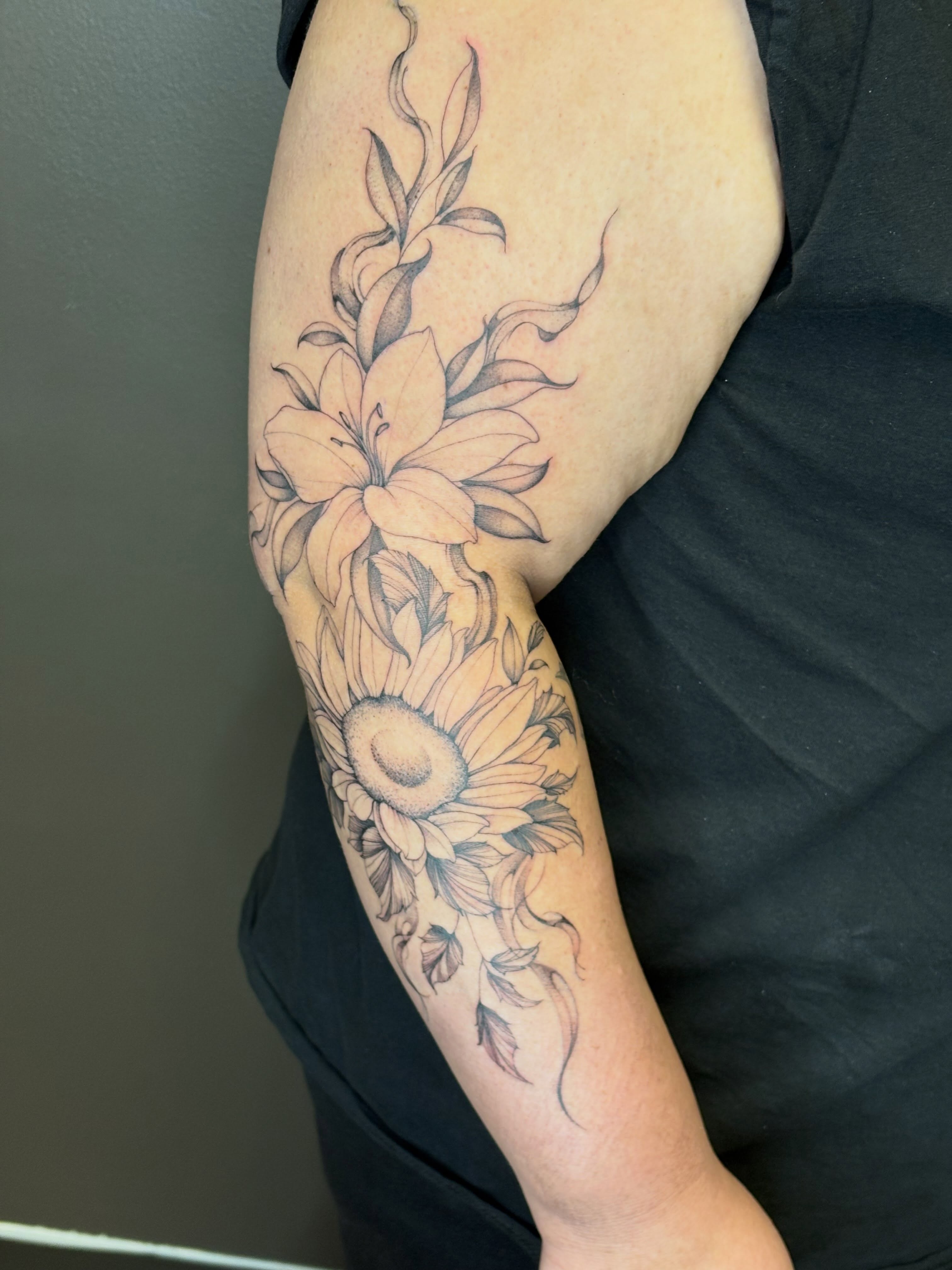 Sunflower and lily black and grey tattoo on the forearm by 🖤Sidney🖤