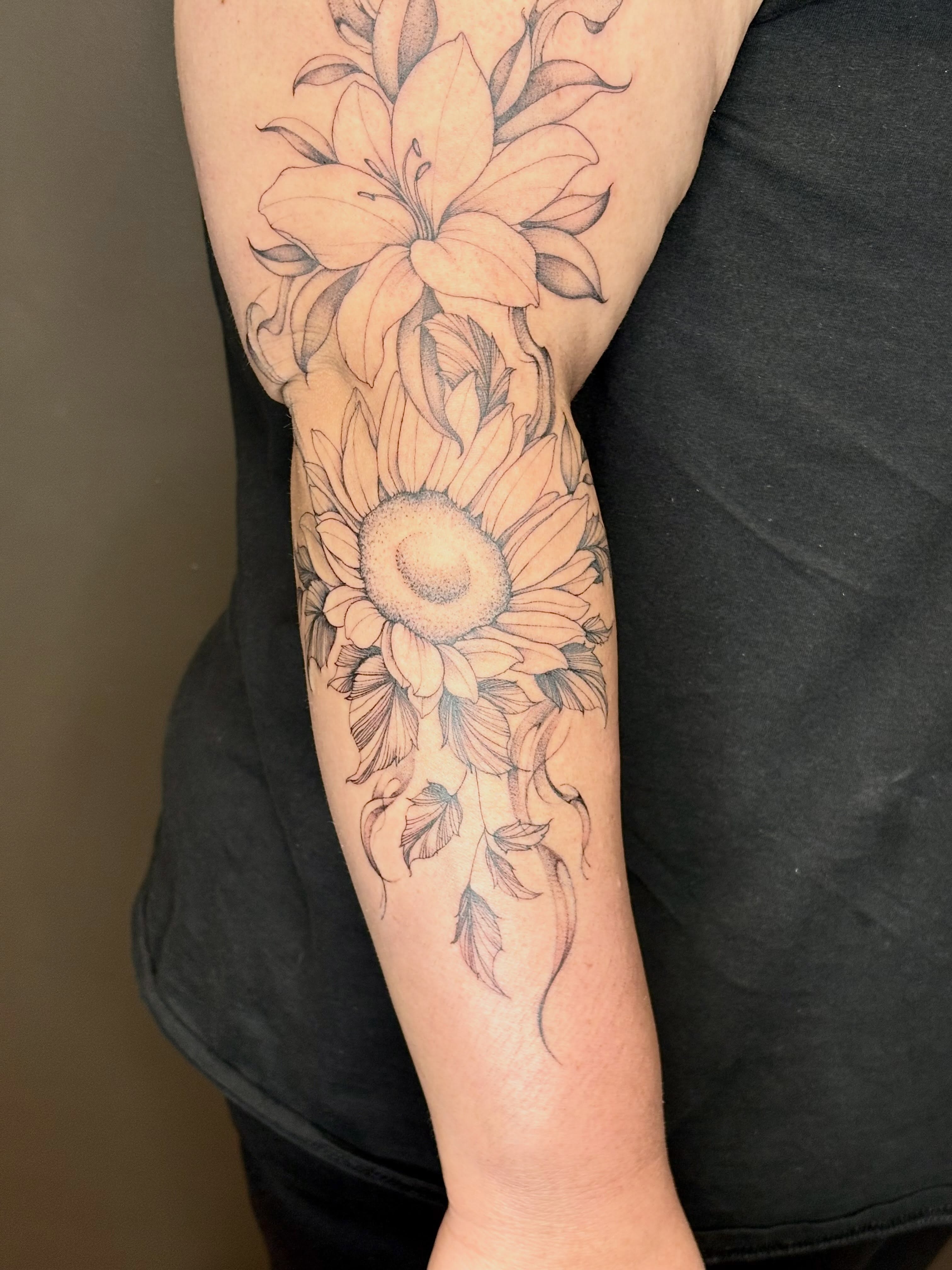 Sunflower and lily black and grey tattoo on the forearm by 🖤Sidney🖤