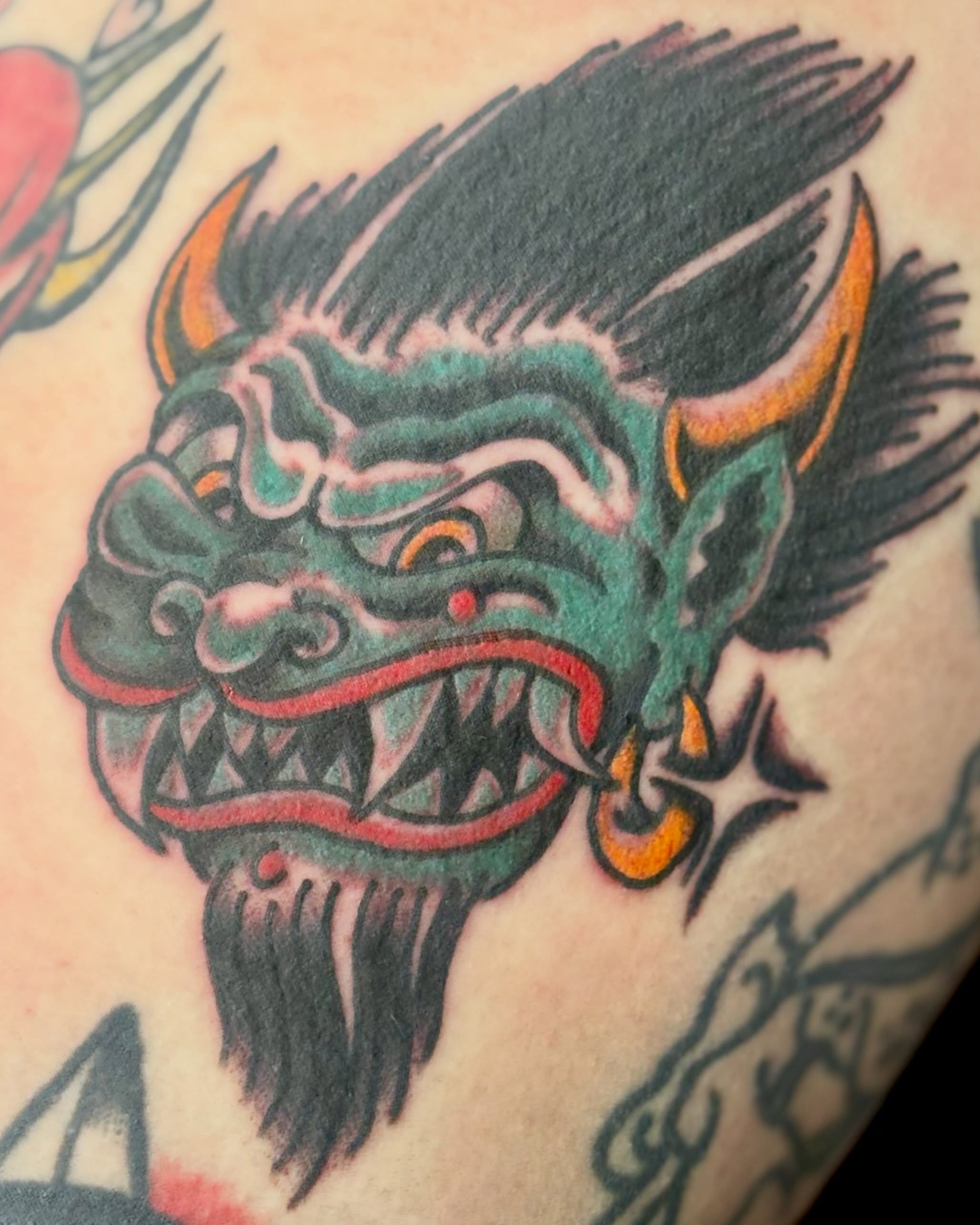 Demon head American traditional tattoo on the forearm by Tia Cave
