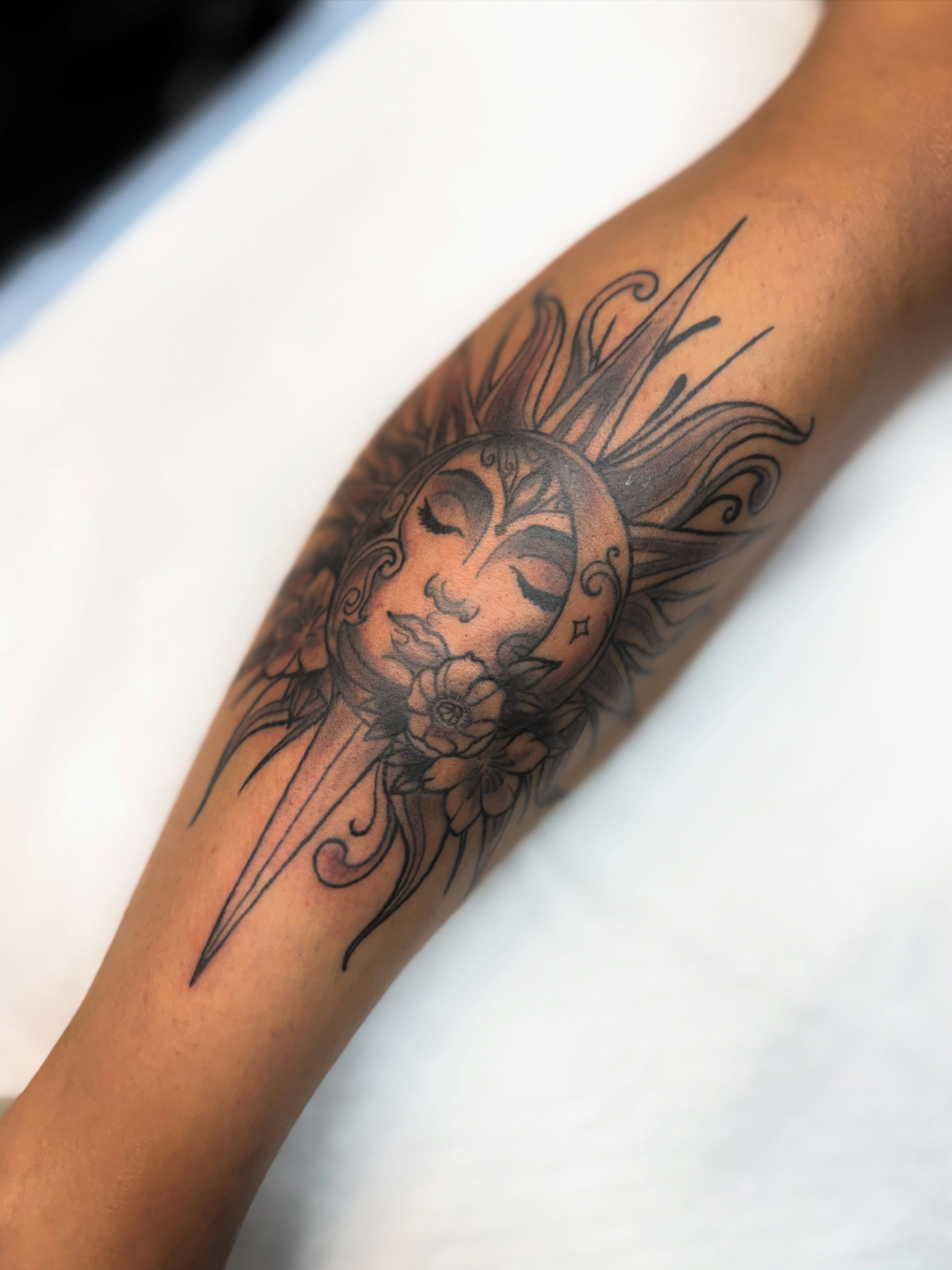 Sun and moon black and grey tattoo on the forearm by Kyndall Lynn, Waxahachie, Texas