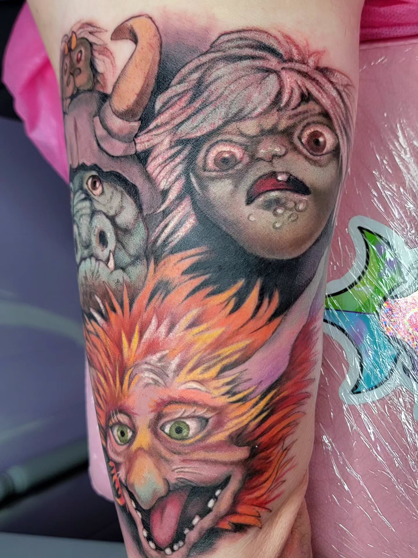 Monster and woman realism tattoo on the forearm by Kerry Rose