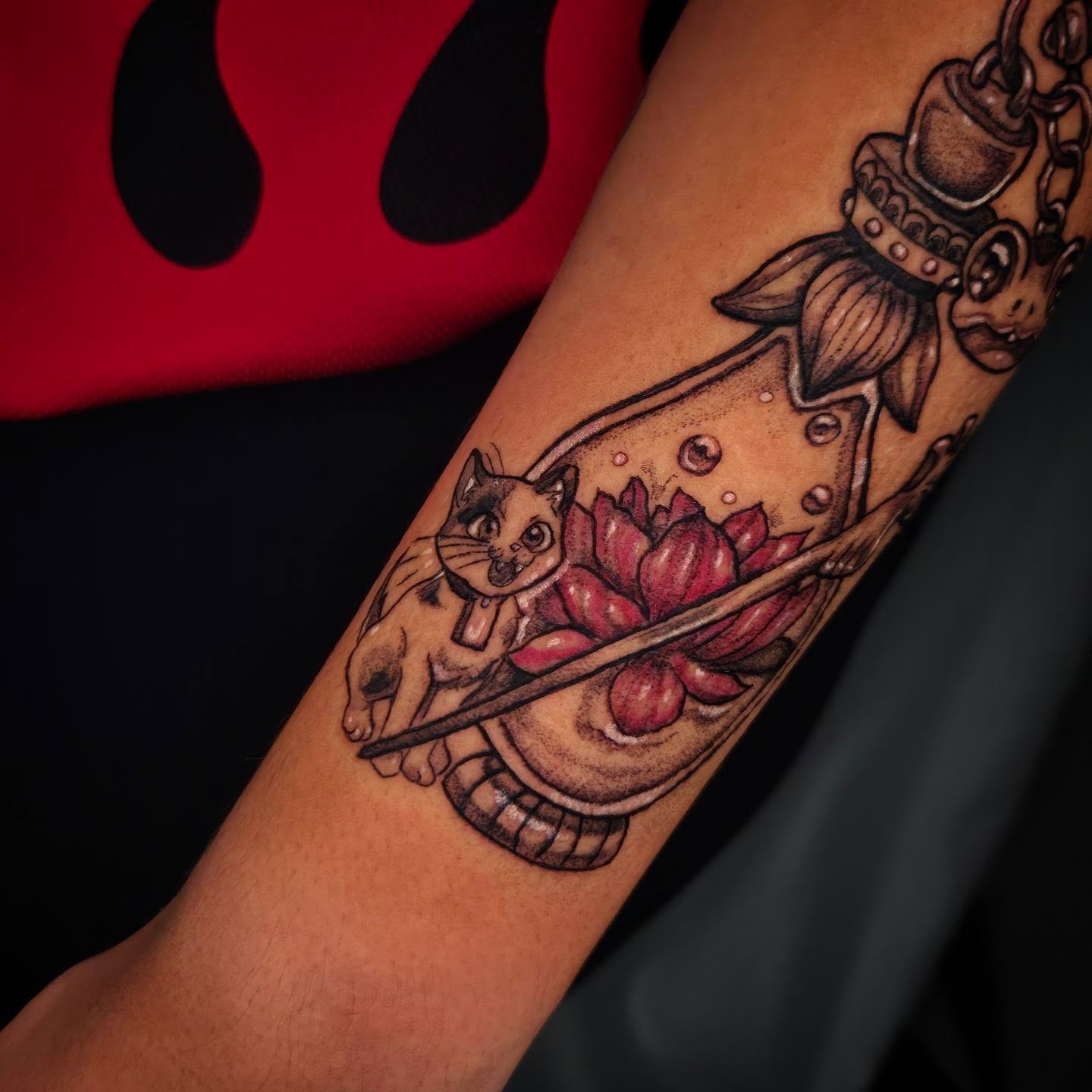 Cat and lotus American traditional tattoo on the forearm by Devin 🖤