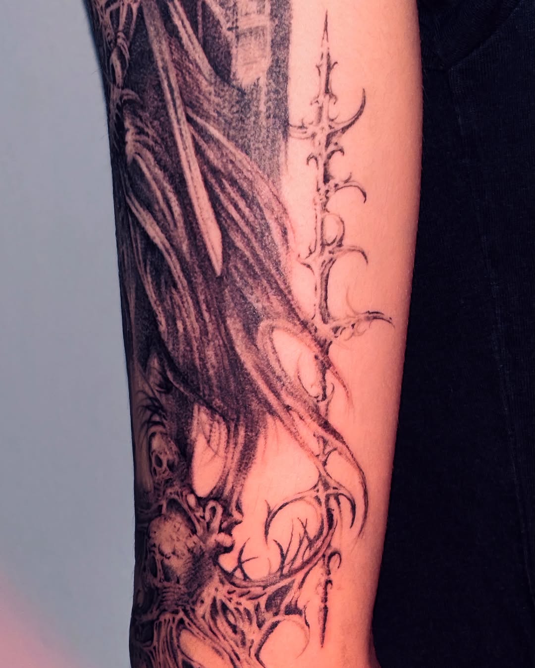 Dragon and skull dark realism tattoo on the forearm by LX7