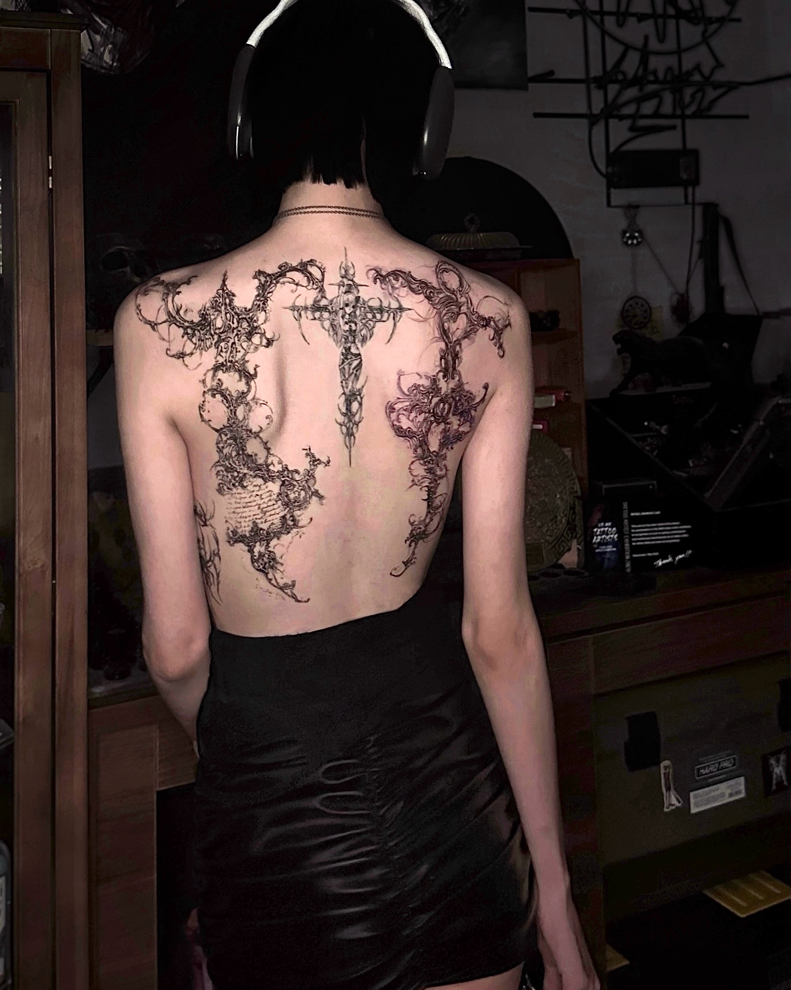 Cross with ornamental details geometric tattoo on the back by @ashencoil