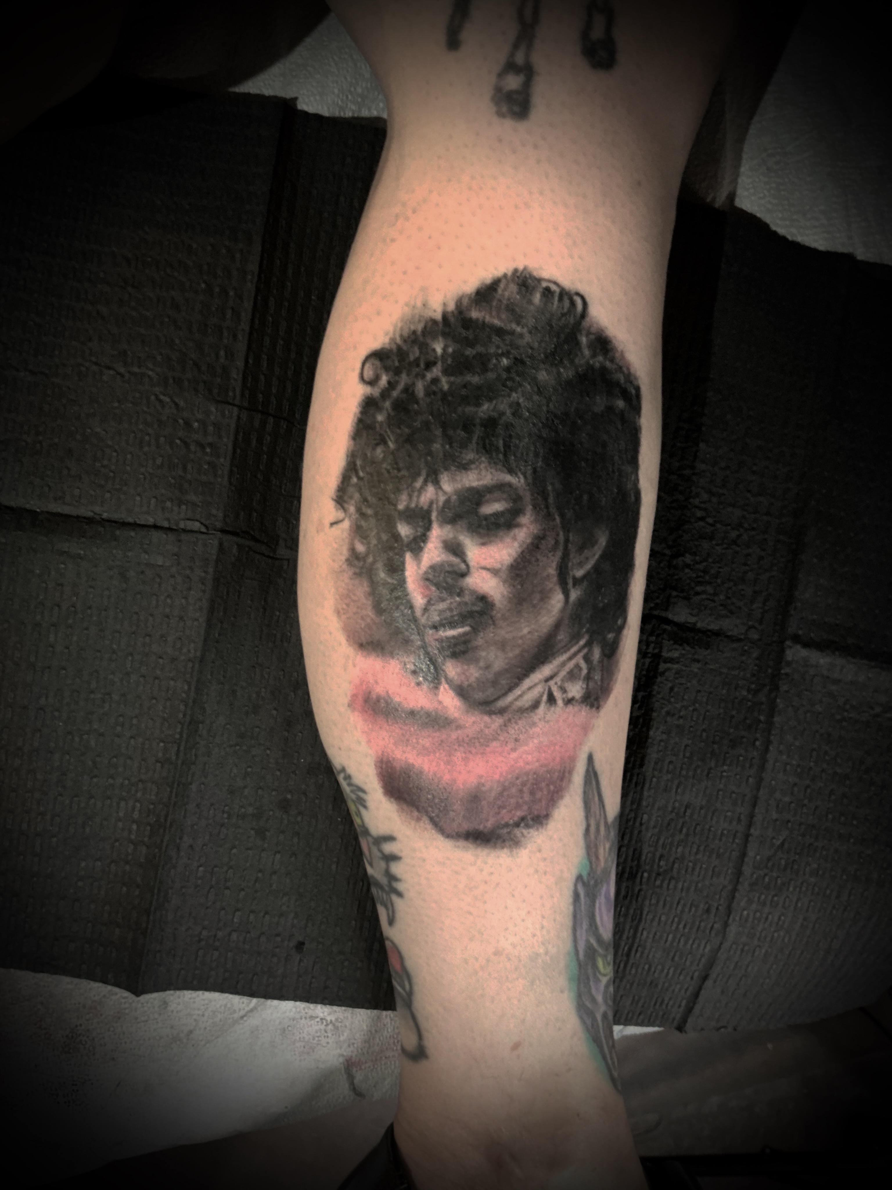 Portrait realism tattoo on the forearm by Bobby Trefz