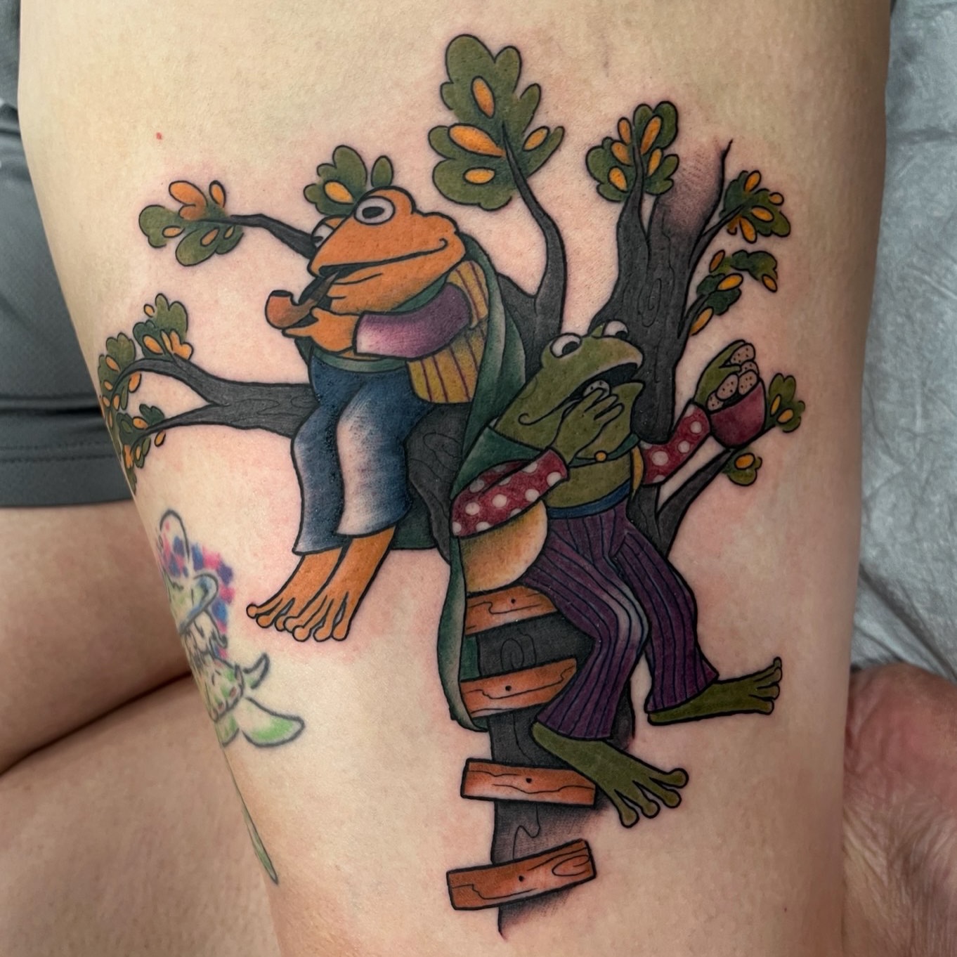 Frogs on tree American traditional tattoo on the thigh by rocky love