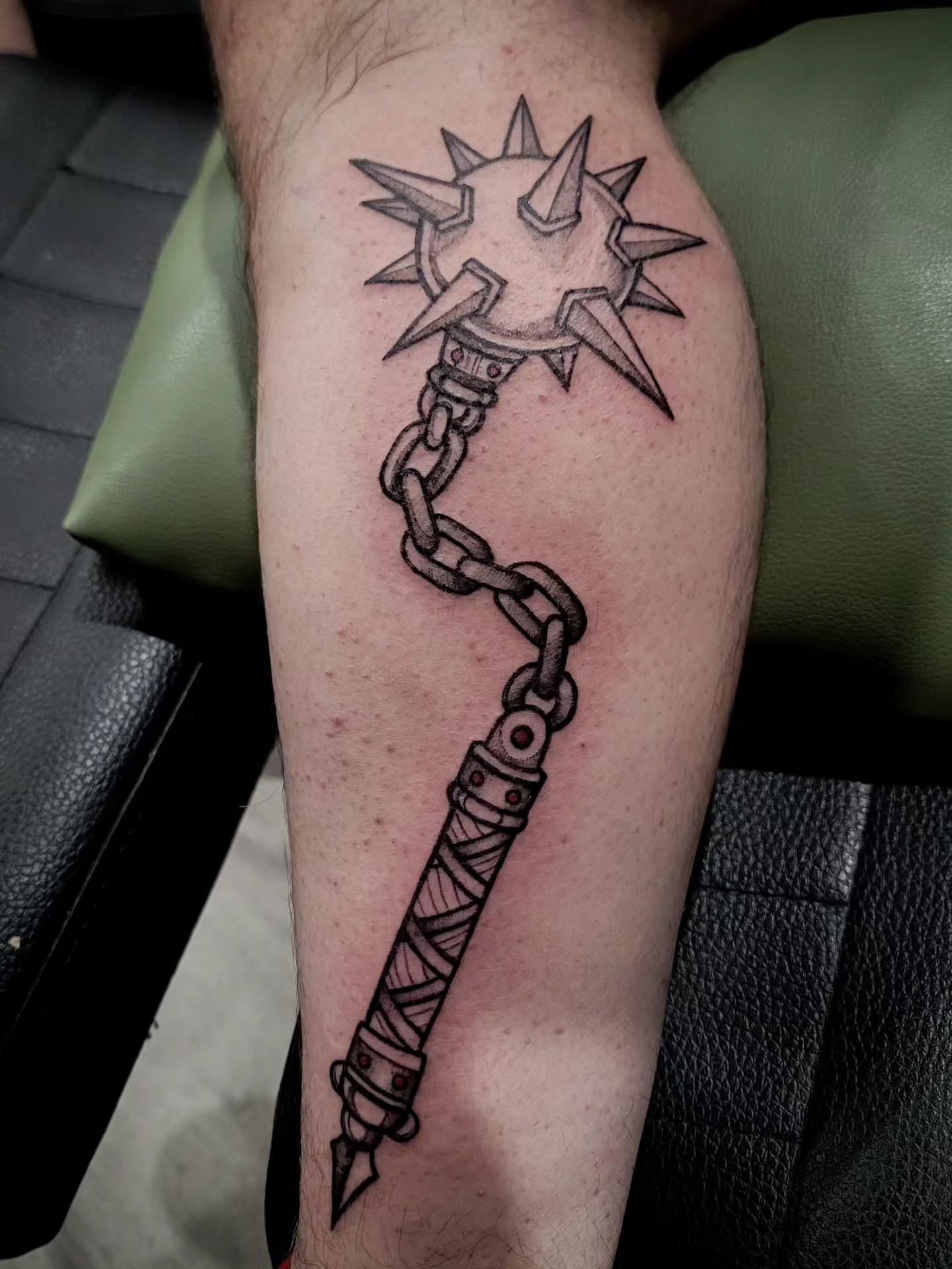 Chain weapon black and grey tattoo on the forearm by Tricky Lake, Newfield, New Jersey