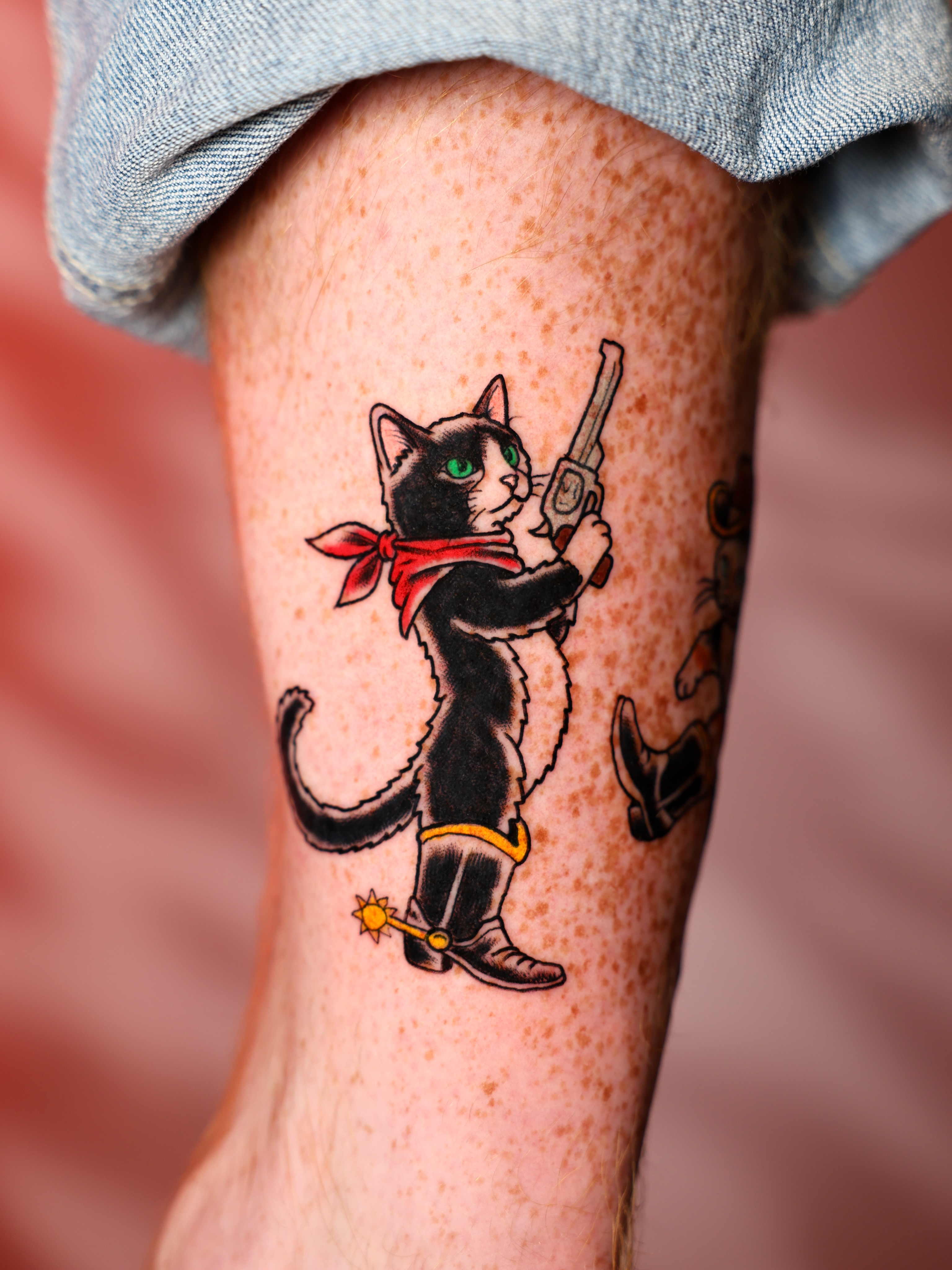 Cat cowboy American traditional tattoo on the forearm by Josh Brownell