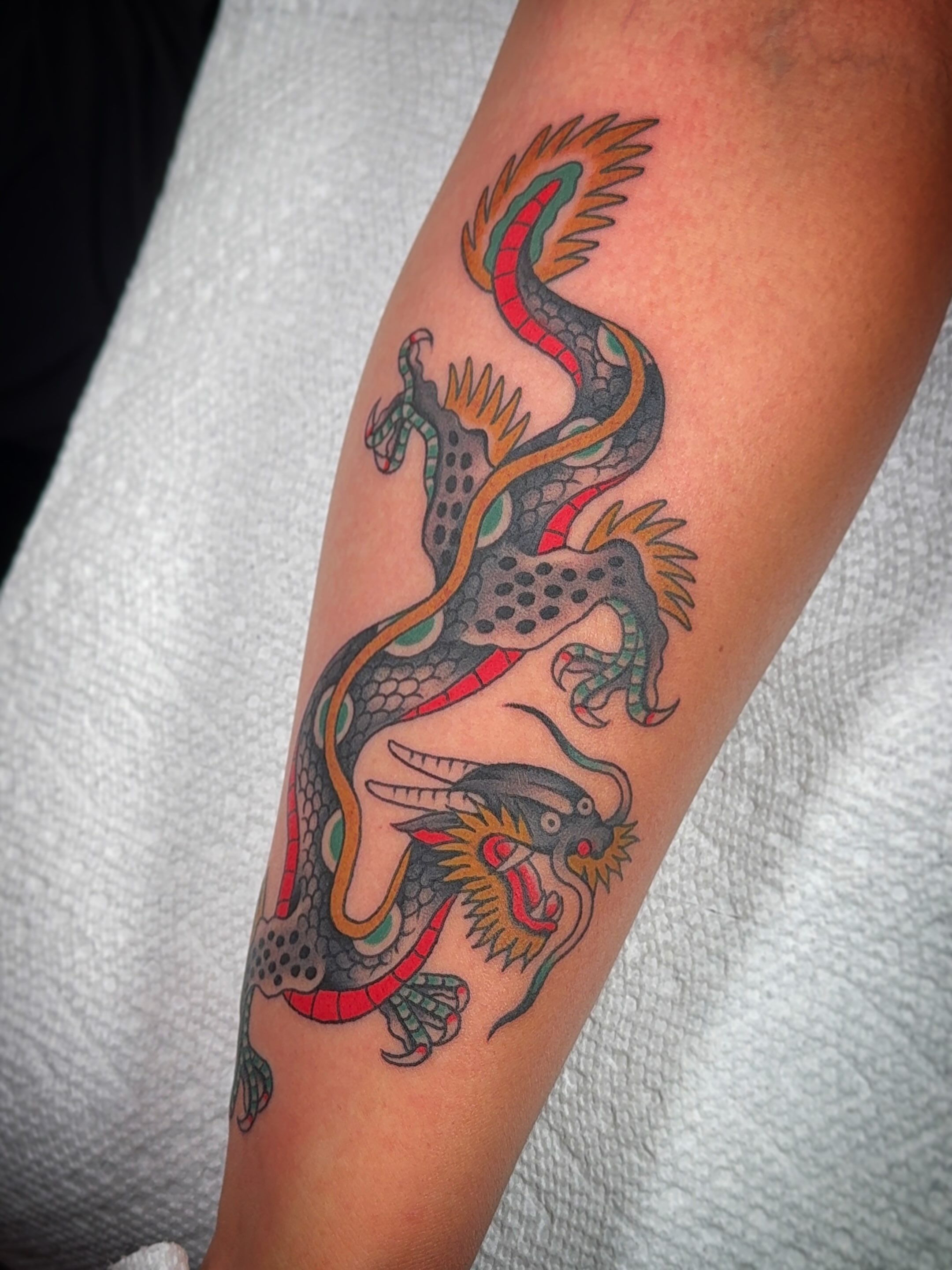 Dragon American traditional tattoo on the forearm by Collin Rigsby, Minneapolis, Minnesota