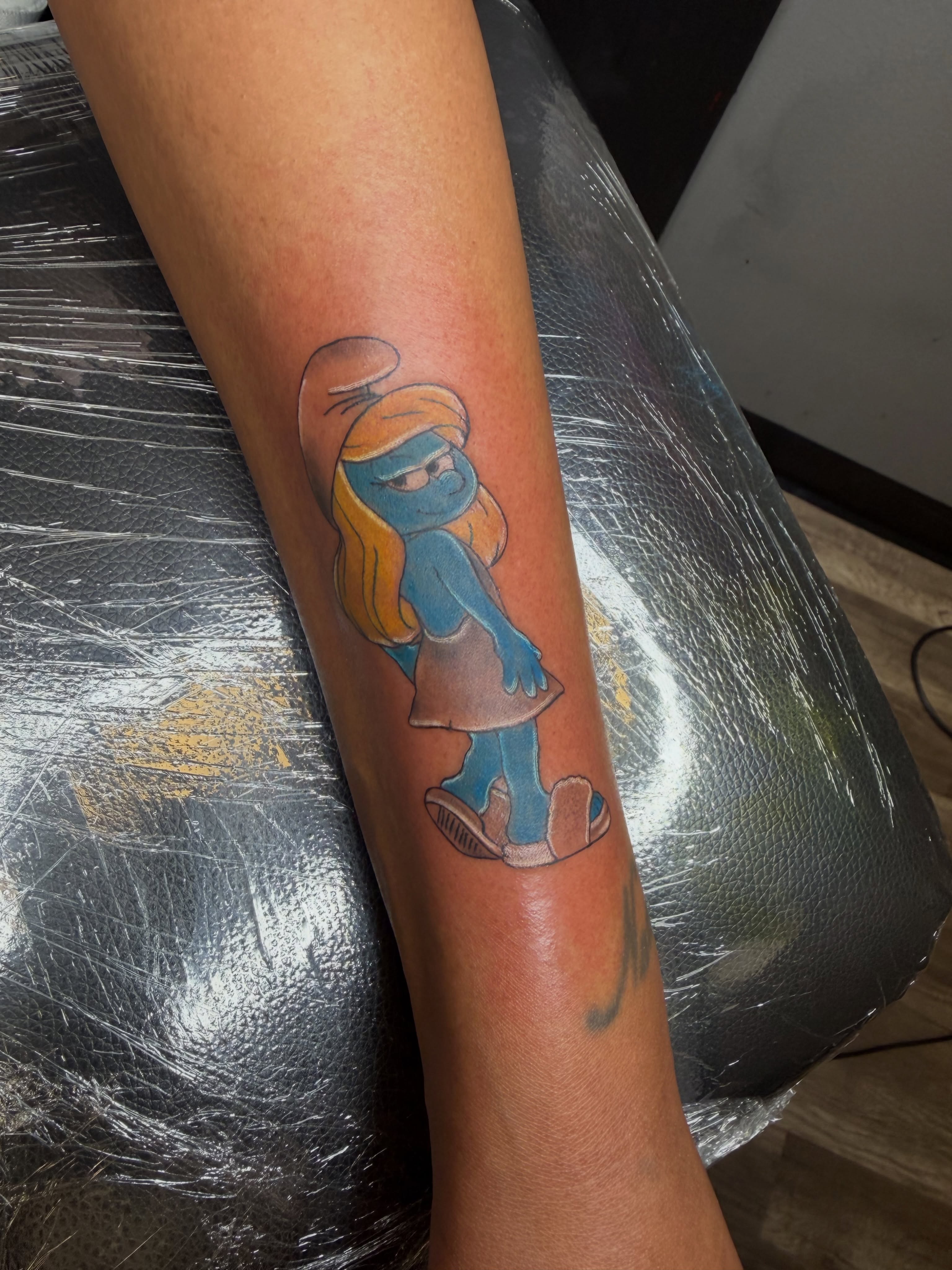 Smurfette dotwork tattoo on the forearm by Rain David