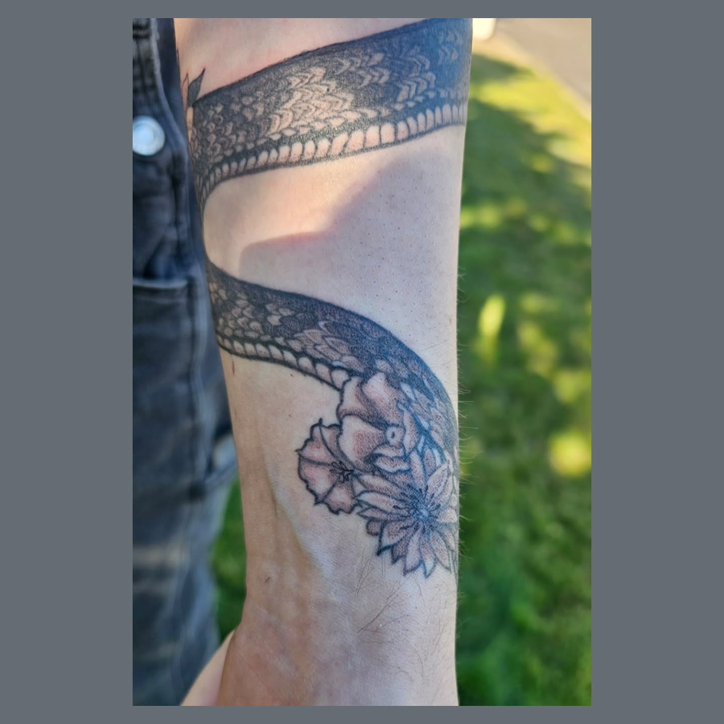 Snake and peony black and grey tattoo on the forearm by The Fabled Tattooist (Alyssa Summers), Eagle Point, Oregon