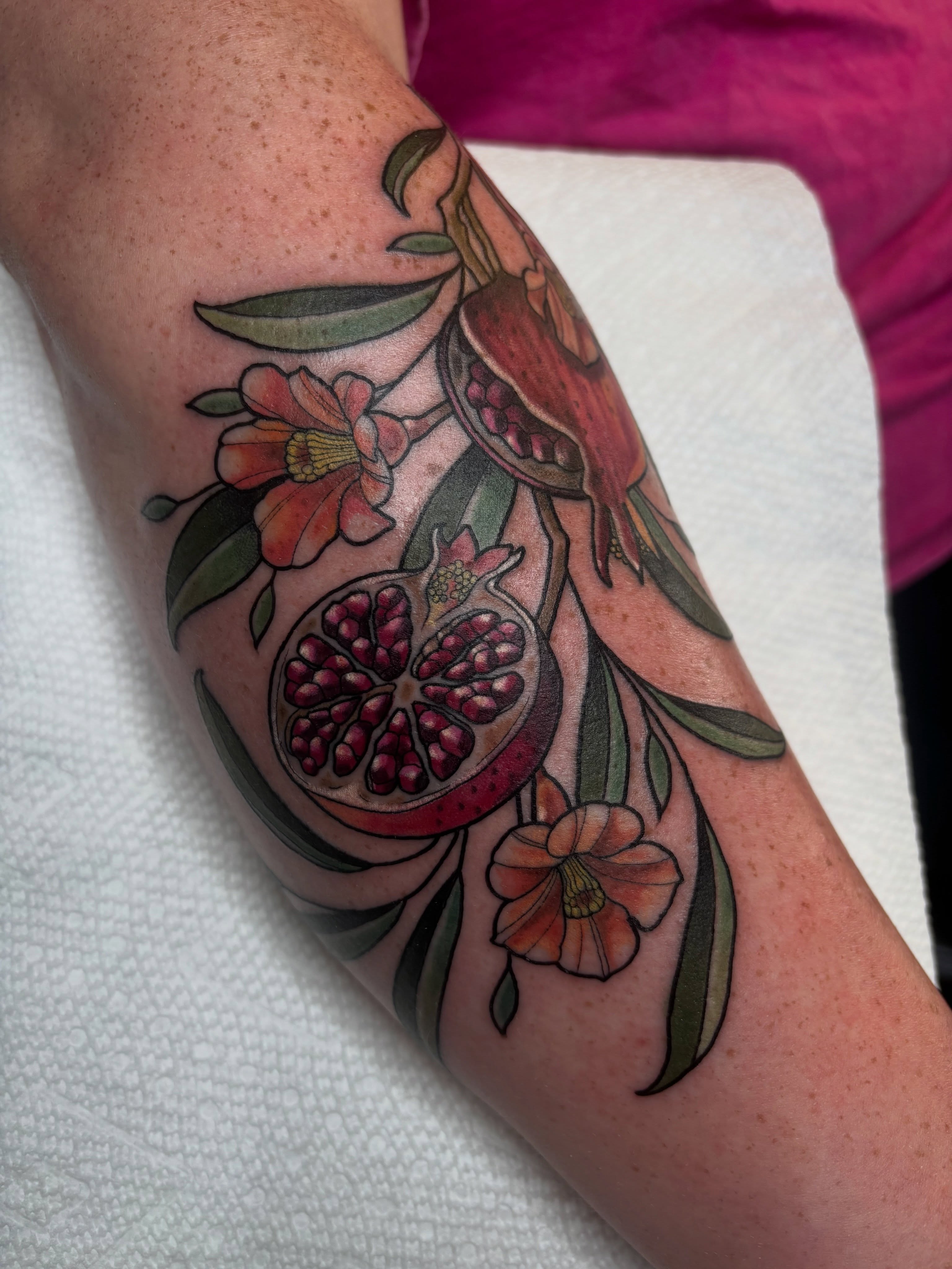 Pomegranate and flowers realism tattoo on the forearm by š¤Madeline Kristenš¤, Somerset, Wisconsin