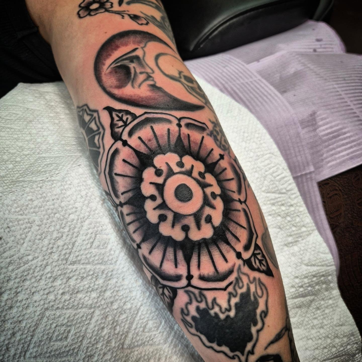 Flower American traditional tattoo on the forearm by Taylor Popkins