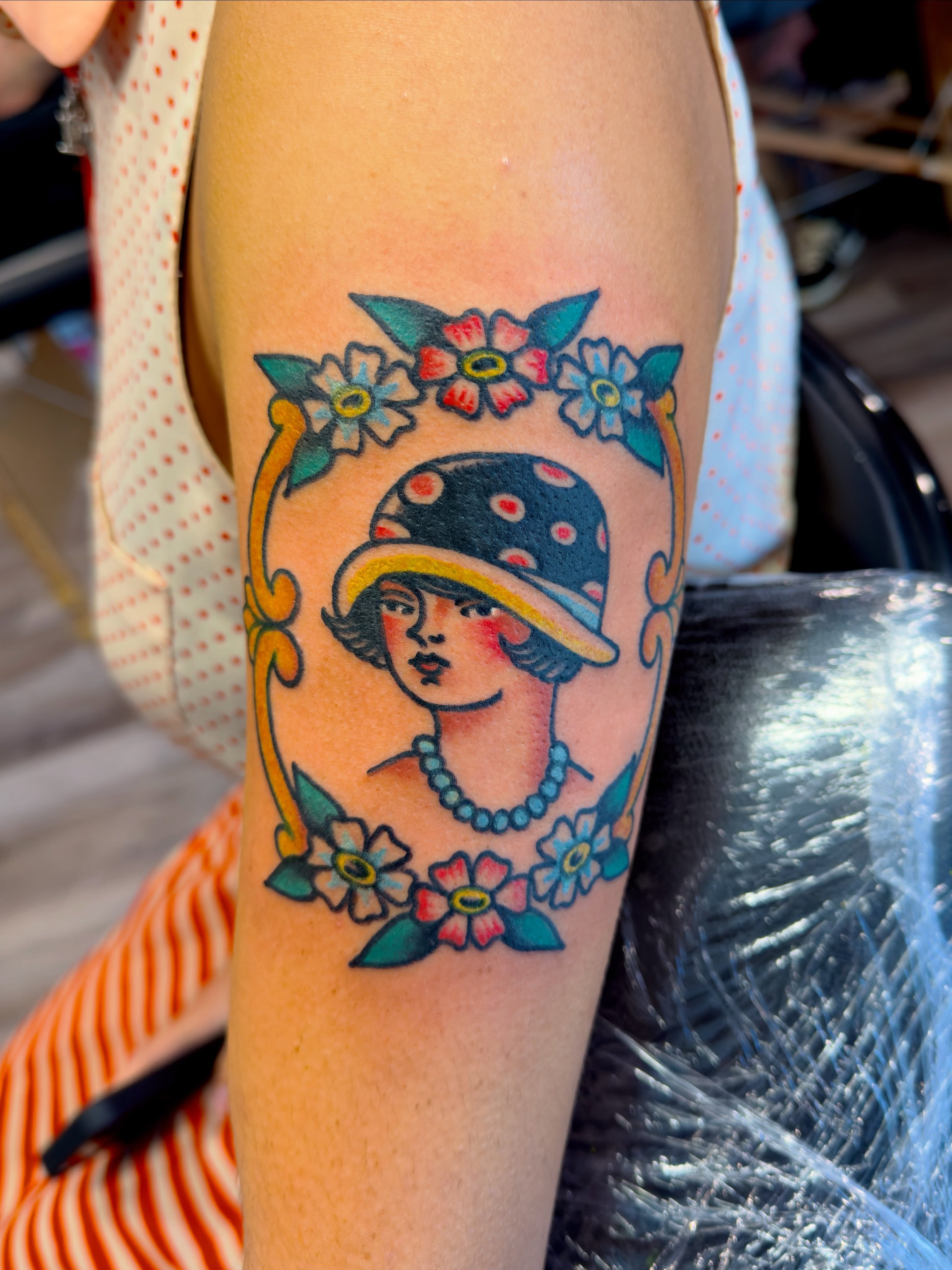 Flapper girl American traditional tattoo on the forearm by Jimmy Kelley