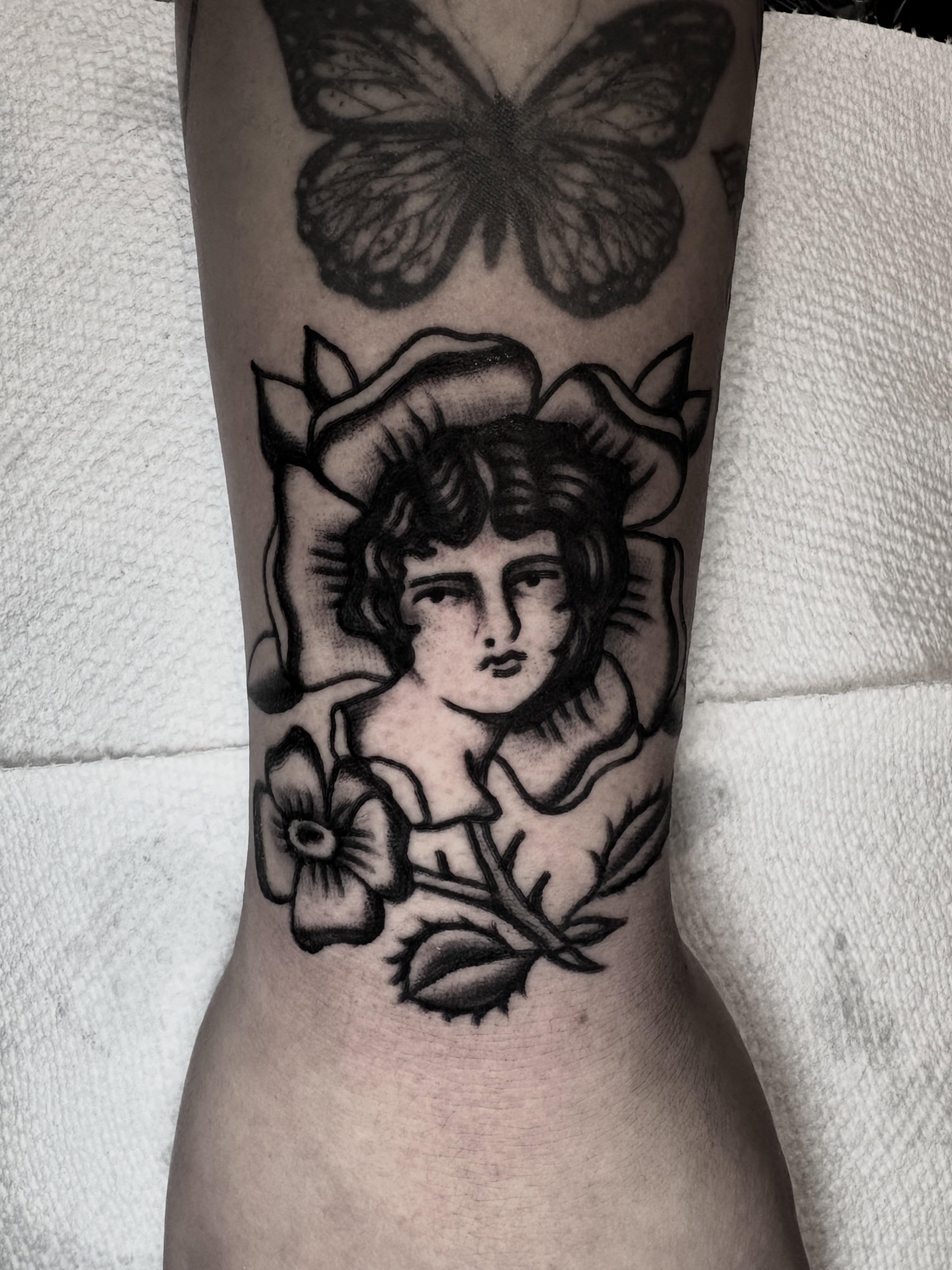 Woman with butterfly American traditional tattoo on the forearm by π³πππ πΆπππππ