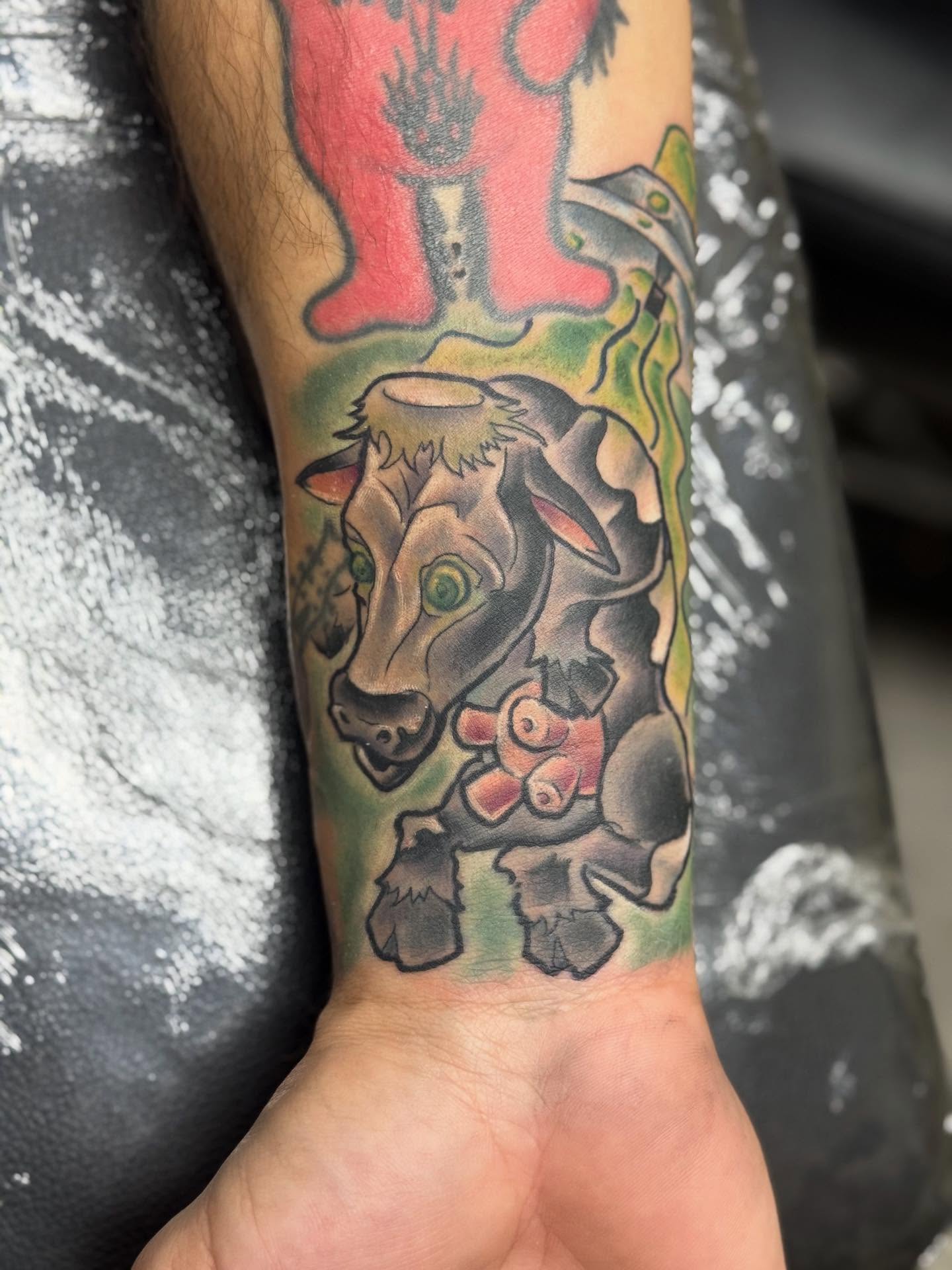 Bull and piglet American traditional tattoo on the forearm by Damian James